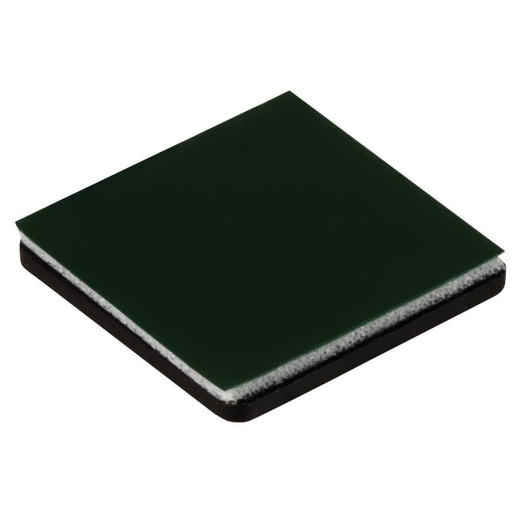Ein kleiner, quadratischer, dunkelgrüner Schleifschaumstoff mit weißer Kante und schwarzer Basis, der zum Glätten von Oberflächen beim Basteln oder in der Holzverarbeitung verwendet wird.
