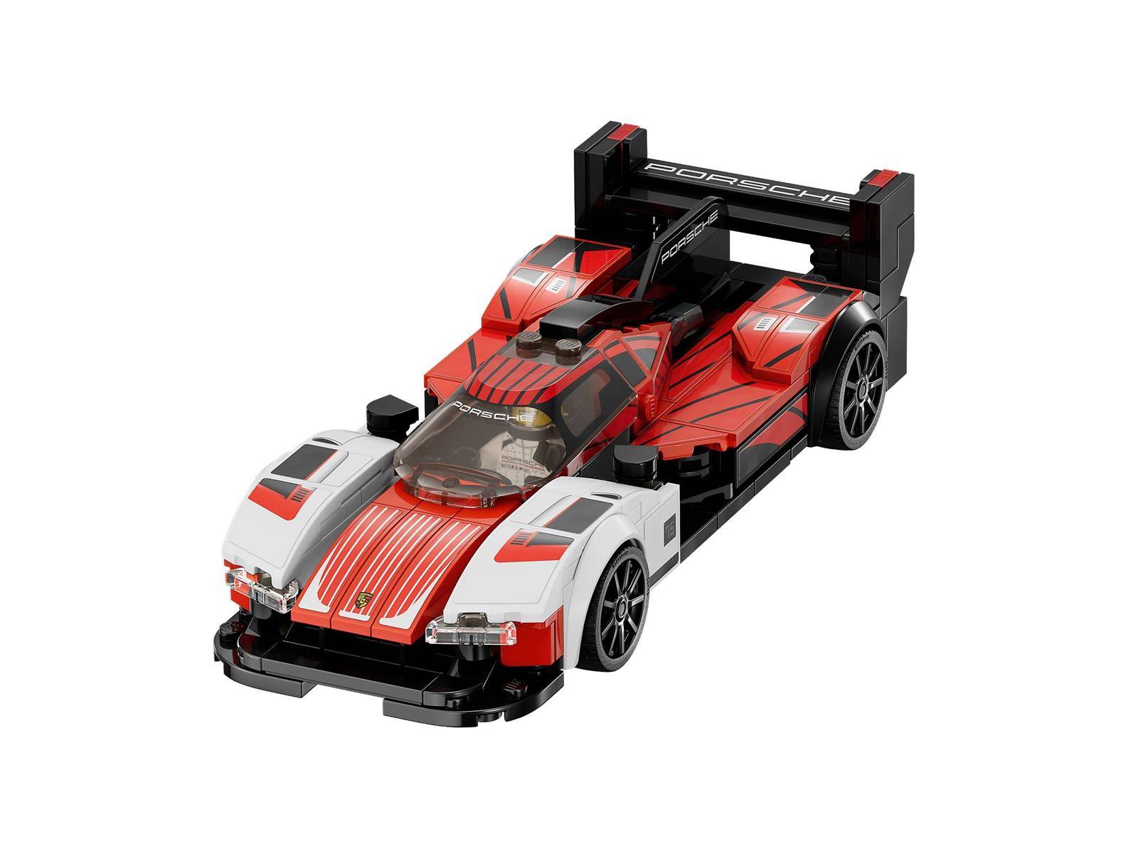 Rotes und weißes LEGO-ähnliches Porsche-Rennwagenmodell auf weißem Hintergrund gezeigt, mit einem hinteren Spoiler und offener Cockpit.