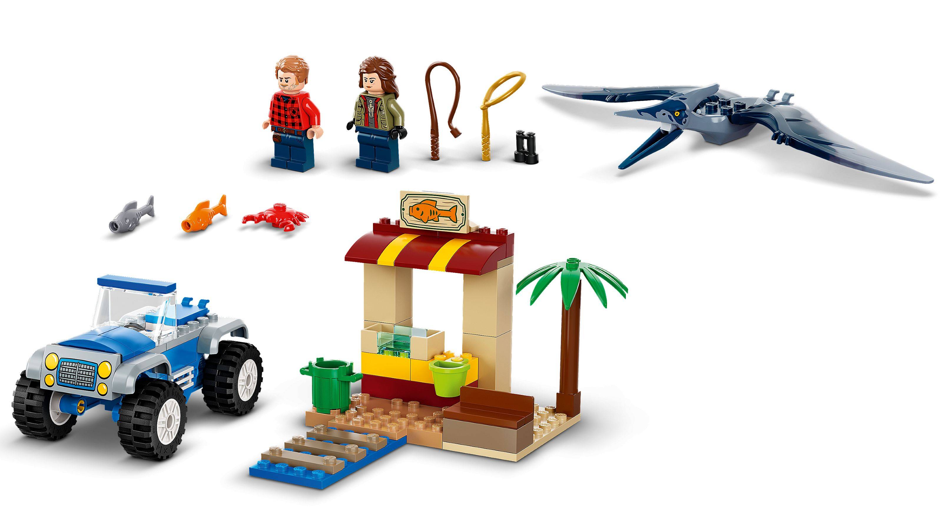 LEGO-Set mit zwei Figuren, Fischstand, Palme und Pterosaurier. Zubehör umfasst Fisch, Hummer, Kamera und Fernglas.