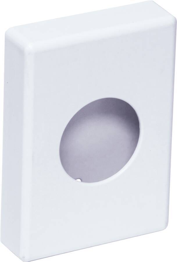 Eine Nahaufnahme eines weißen rechteckigen Objekts mit einem kreisrunden Loch in der Mitte, das einen Schatten im Inneren wirft.