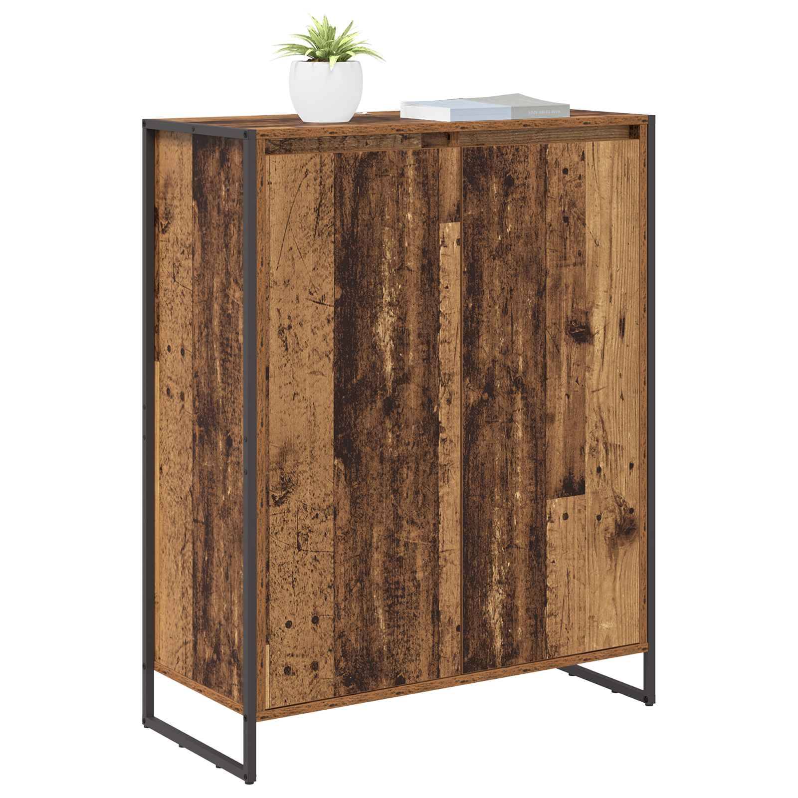 Ein rustikaler Holzschrank mit einem Metallrahmen, auf dem eine Topfpflanze und ein Buch stehen.