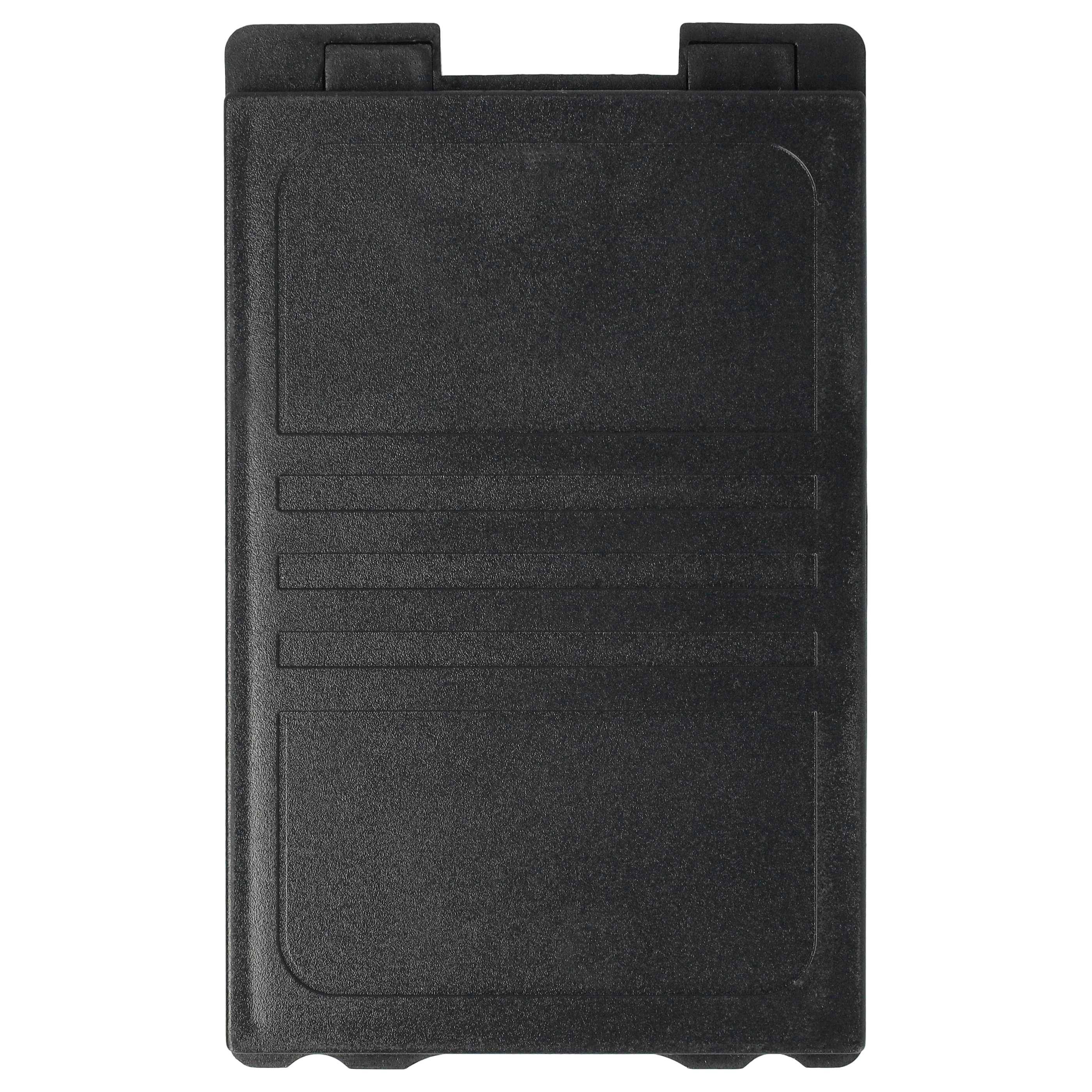 Ein schwarzer rechteckiger Plastikdeckel mit eingetieftem Design, möglicherweise zu Schutzzwecken.