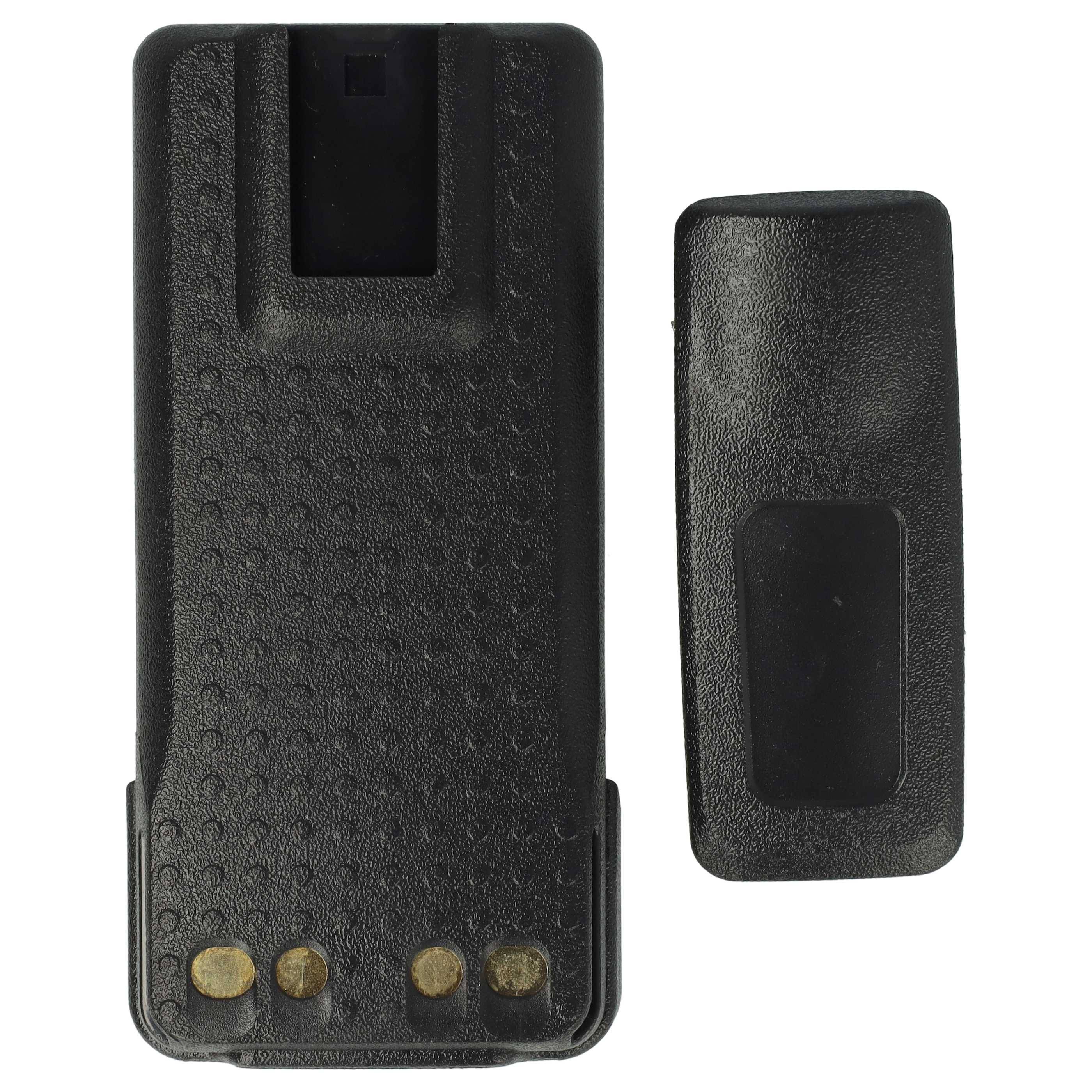 Zwei schwarze, strukturierte Objekte: ein rechteckiges Gerät mit vier goldenen Kontakten am unteren Ende, neben einem passenden Etui oder Deckel.