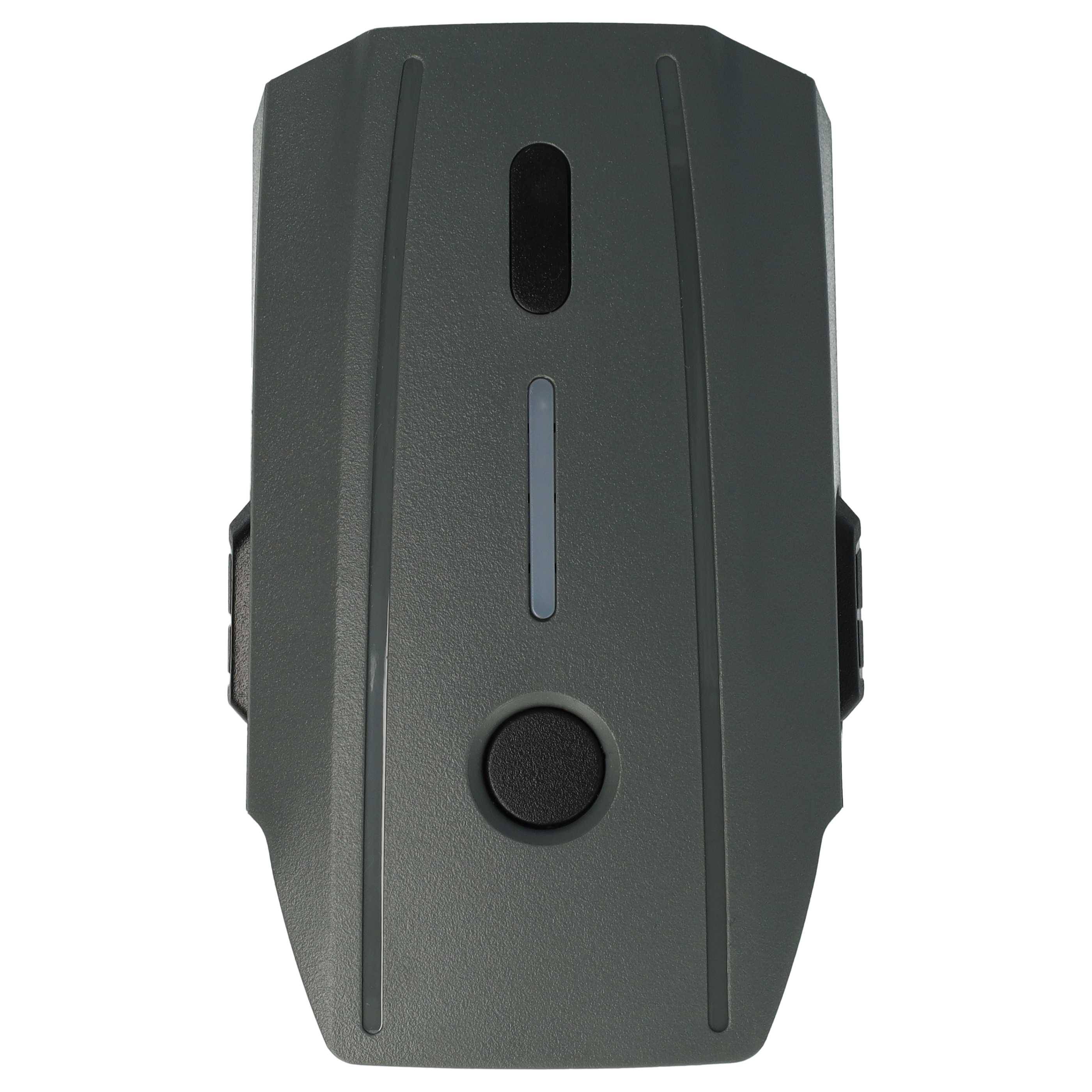 Draufsicht einer grauen Drohnenbatterie mit einem kreisförmigen Einschaltknopf und LED-Statusanzeigen.