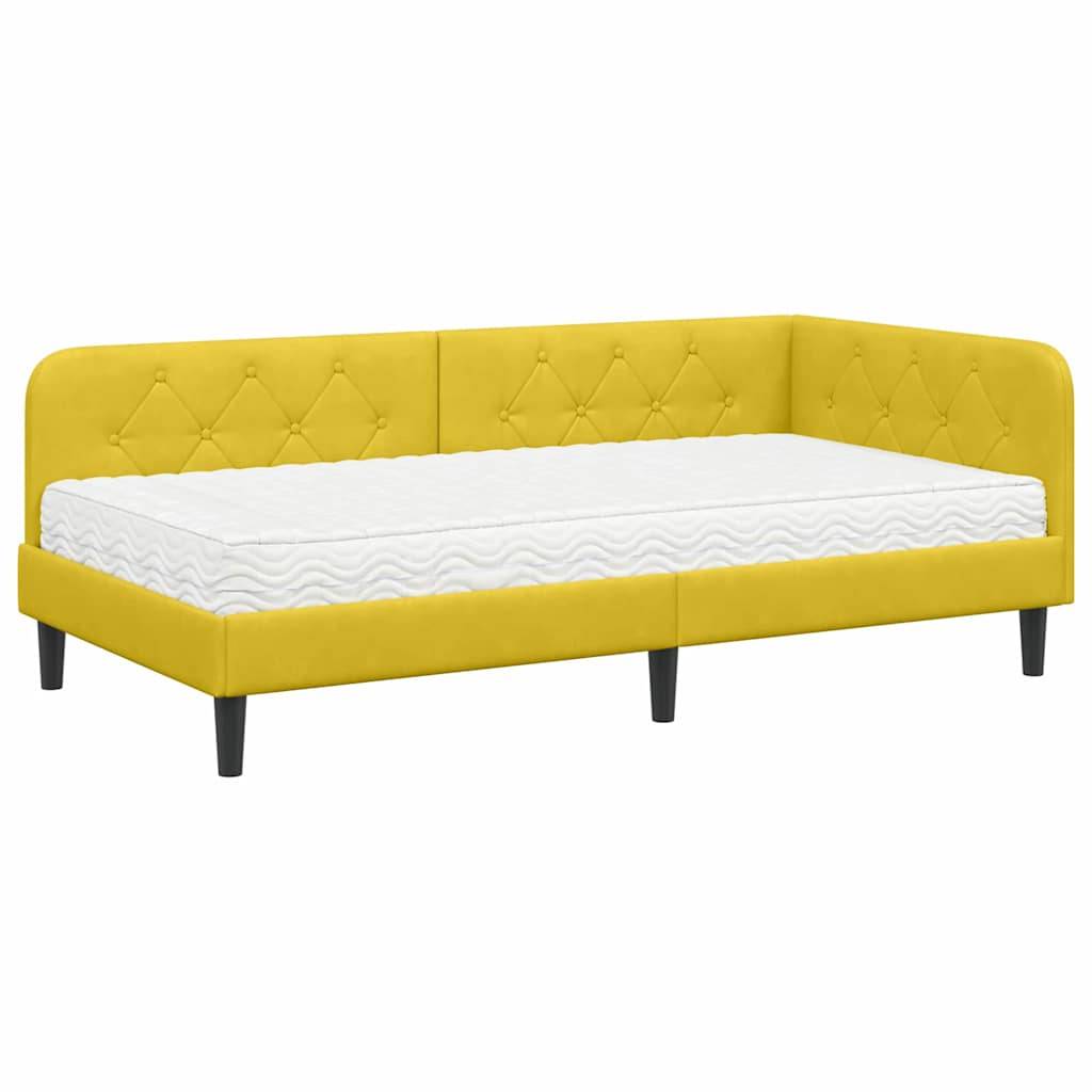 Gelbes gepolstertes Eckschlafsofa mit gesteppter Rückenlehne und weißer Matratze, ausgestattet mit schwarzen Beinen, passend für moderne Wohnbereiche.