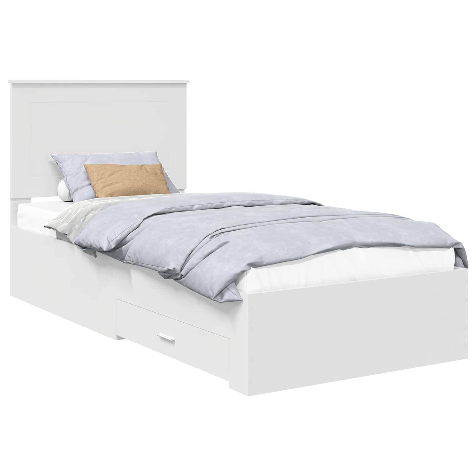 Ein weißes Einzelbett mit hellblauer und beiger Bettwäsche, mit Kopfteil und einer Schublade zur Aufbewahrung darunter.
