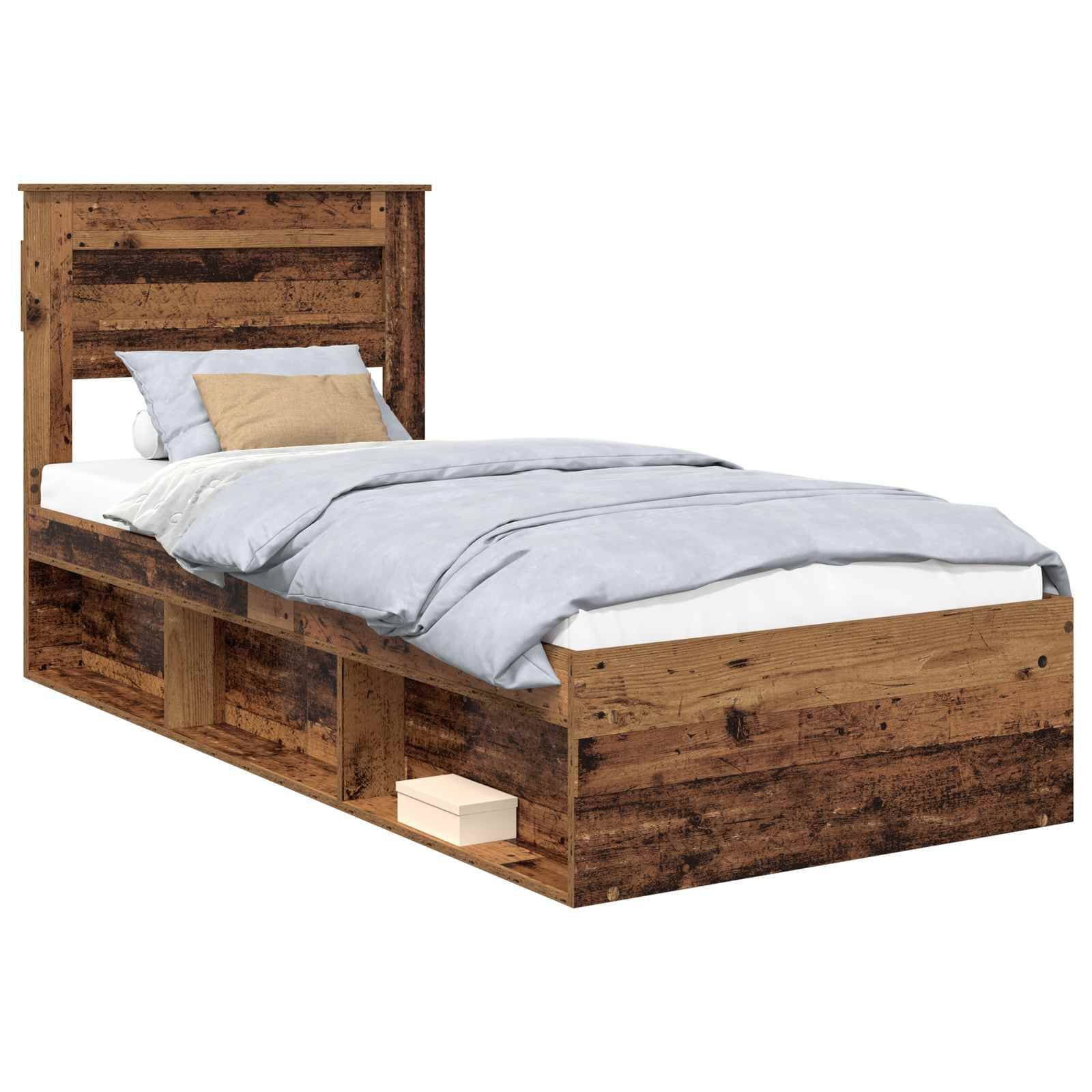 Ein rustikales Holz-Zwillingsbett mit Kopfteil und Staurageschubladen darunter. Das Bett ist ordentlich gemacht mit hellblauer Bettwäsche und einem beigen Kissen.