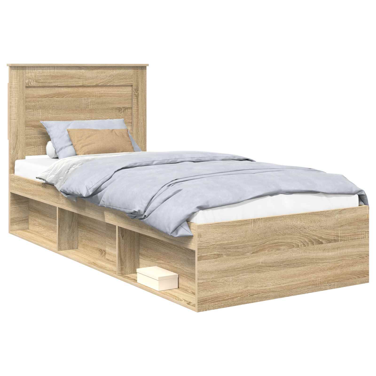 Ein Holz-Doppelbett mit hellbrauner Oberfläche verfügt über ein Kopfteil und eine Matratze, die mit einem grauen Bettüberwurf und einem kleinen beigen Kissen bedeckt sind.