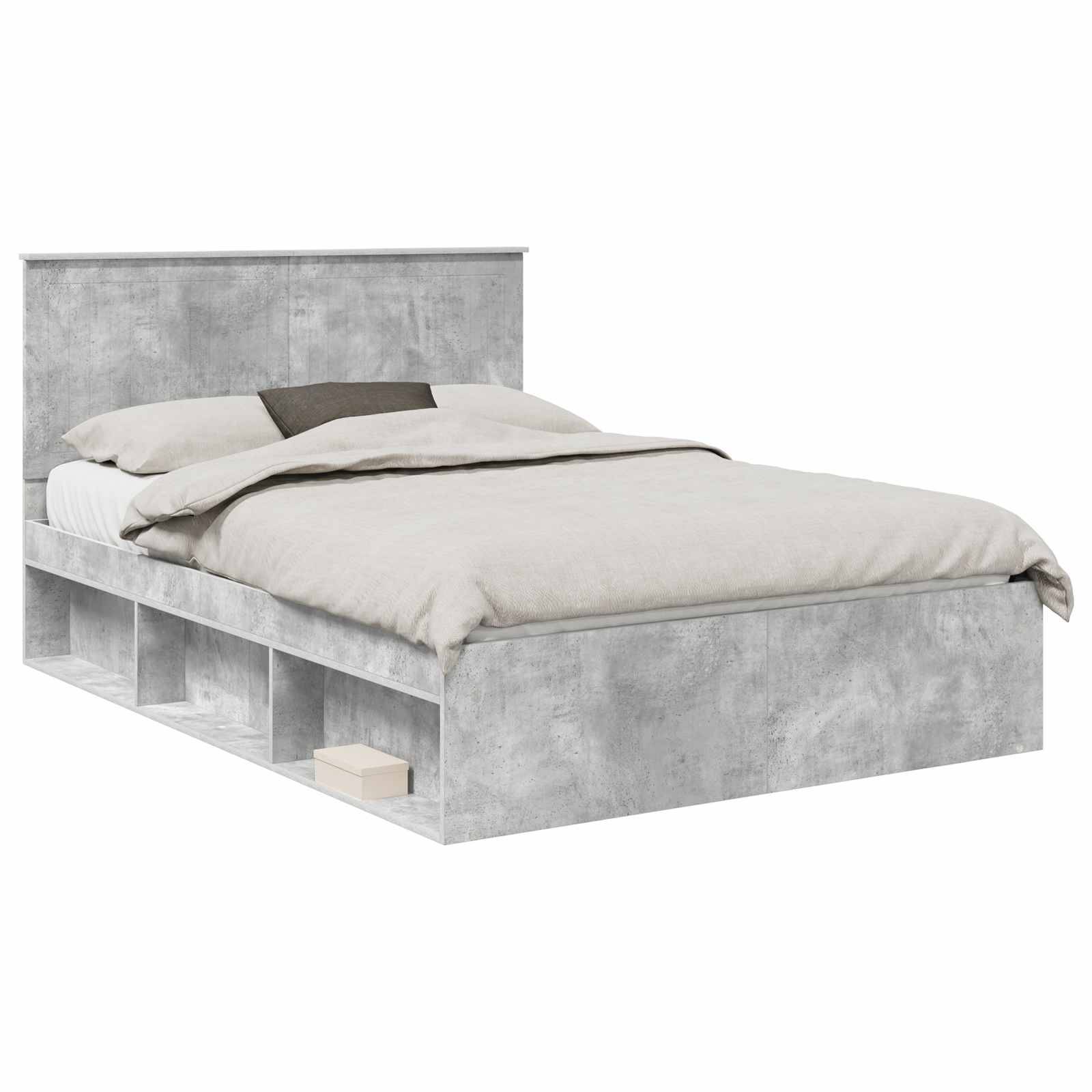 Ein graues gepolstertes Bett mit integrierten Stauraummöglichkeiten im Rahmen, ausgestattet mit einem üppigen Kopfteil und ordentlich arrangierten Bettwäschestücken.