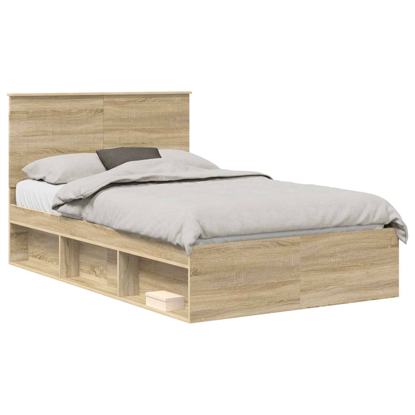 Ein Holzbett mit einem Kopfteil und Stauraumregalen darunter, ausgestattet mit grauer Bettwäsche, einschließlich eines Kissens und ordentlich aufgeschichteter Bettdecke.