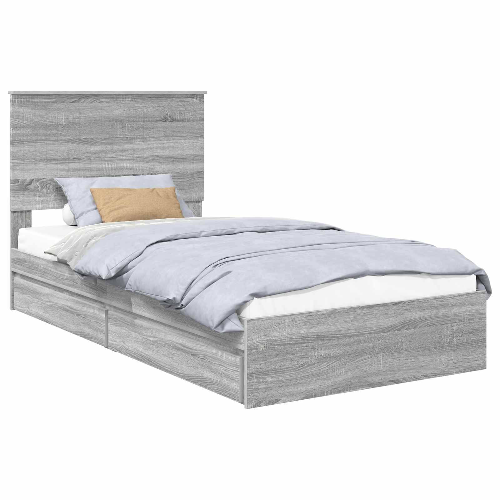 Ein grauer Holzbett mit hohem Kopfteil und zwei Staurageschubladen darunter, bezogen mit hellblauen Bettwäsche und einem beigen Kissen.