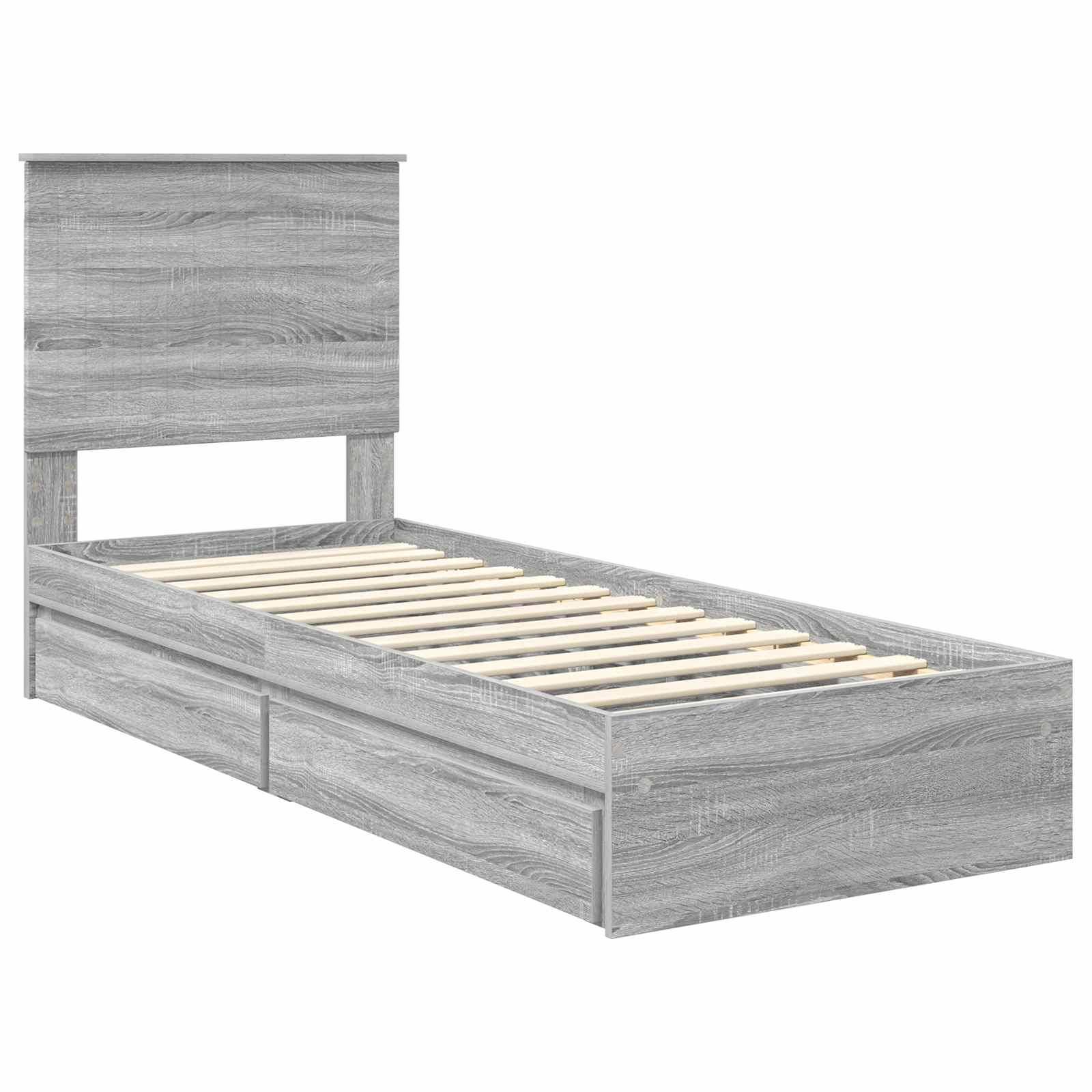Ein graues Holzbett-Einzelrahmen mit Kopfteil und zwei Staurageschubladen darunter.