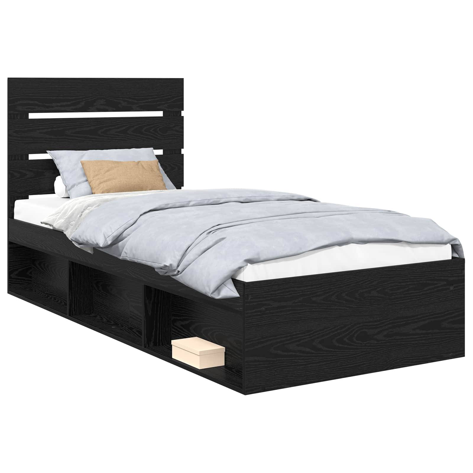 Ein schwarzer Holzbettrahmen mit modernem Kopfbrett-Design, ausgestattet mit integrierten Stauraummöglichkeiten darunter. Das Bett ist bezogen mit grauer Bettwäsche und einem beigen Kissen.