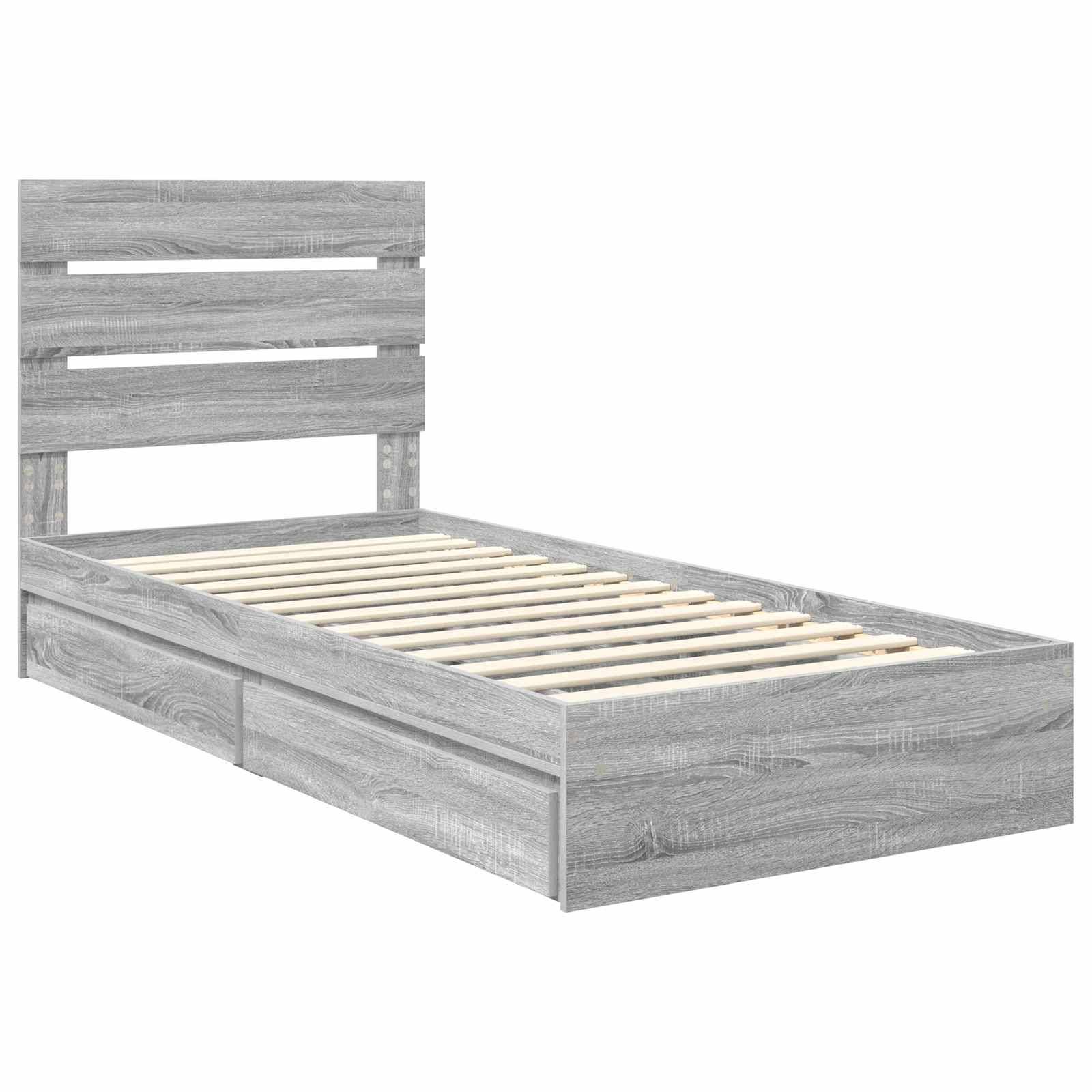 Grauer Holzbettrahmen mit Lattenrost und zwei Staurageschubladen darunter. Schlichte und minimalistische Gestaltung.
