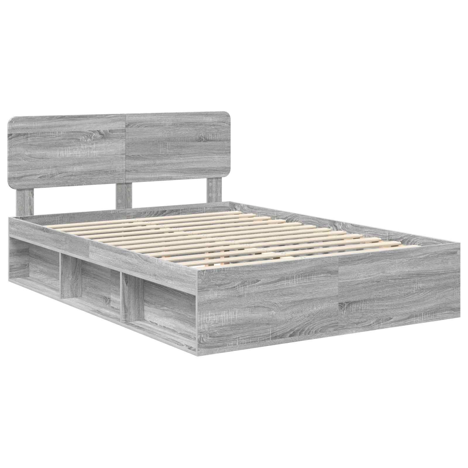 Ein grauer Holz-Plattformbettrahmen mit Kopfteil und Stauraumregalen darunter. Die Latten sind sichtbar, was zeigt, wo eine Matratze platziert werden würde.