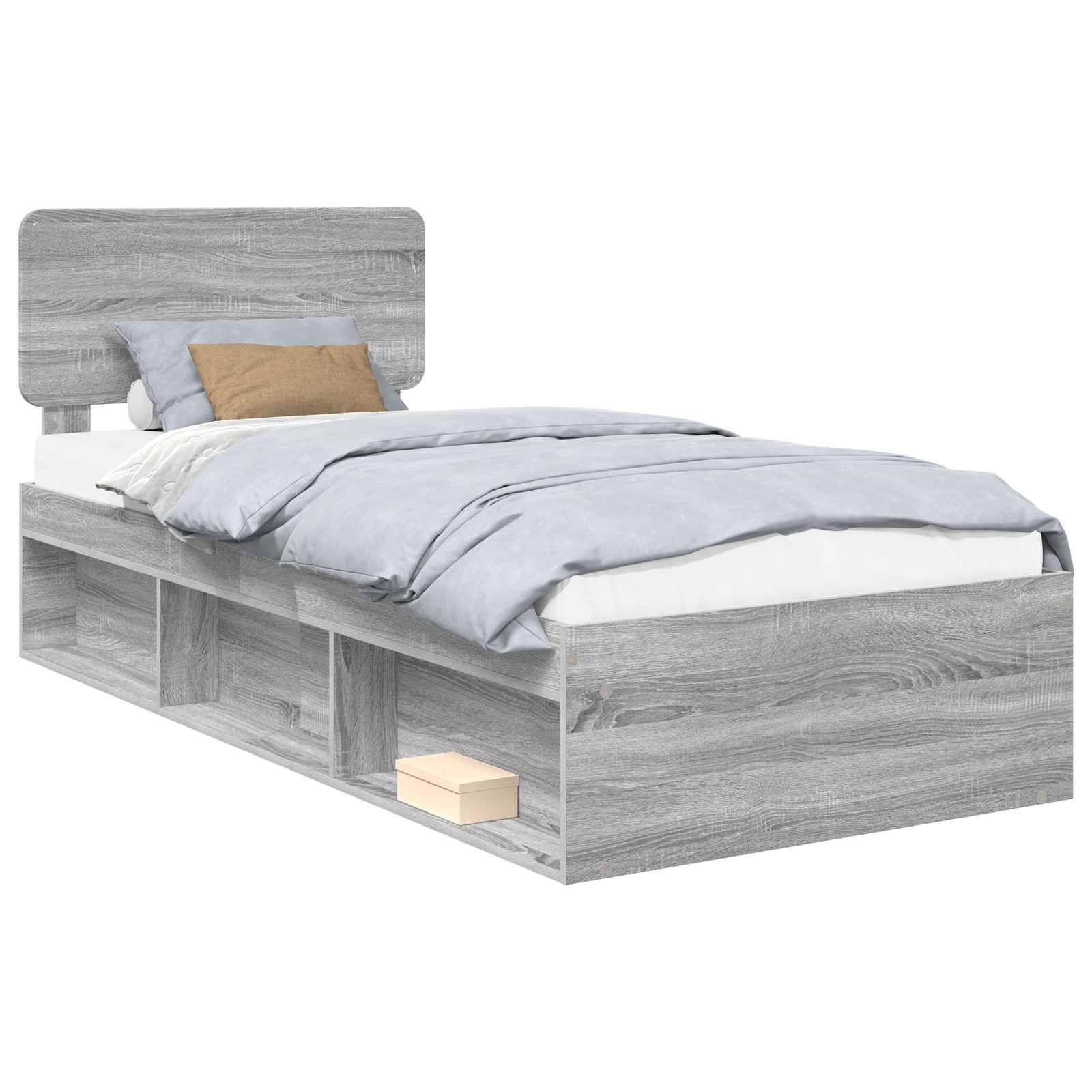Ein grau gefärbtes Holzbett mit Stauraumregalen darunter, hellblaue Bettwäsche und zwei Kissen, eines in Grau und eines in Braun.