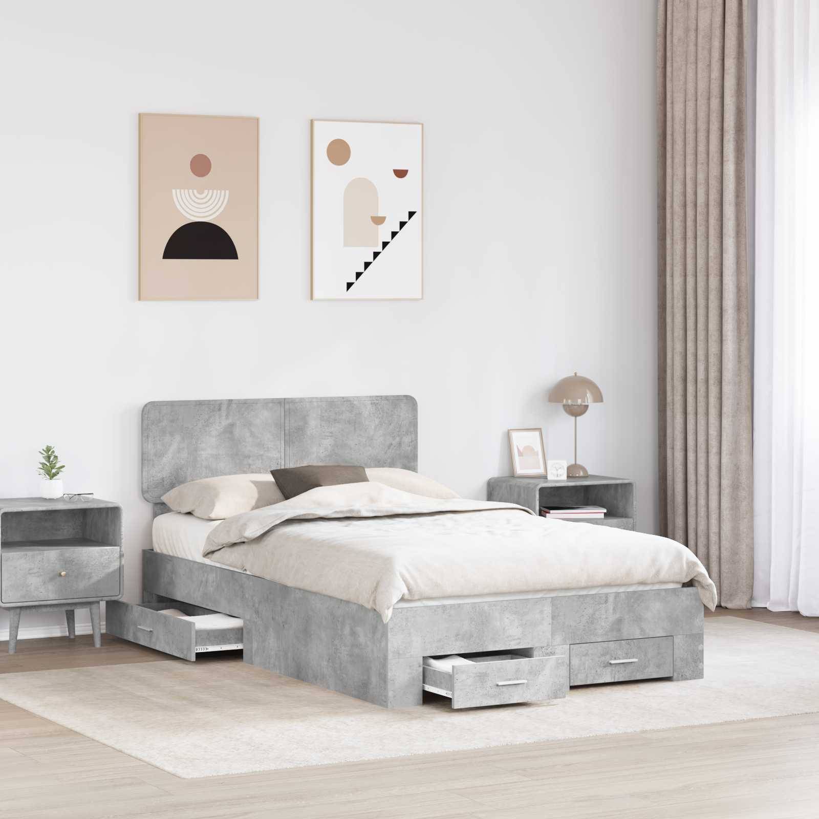 Ein modernes Schlafzimmer mit einem grauen Bett mit integrierten Schubladen, flankiert von zwei Nachttischen. Zwei abstrakte Kunstwerke hängen über dem Bett.