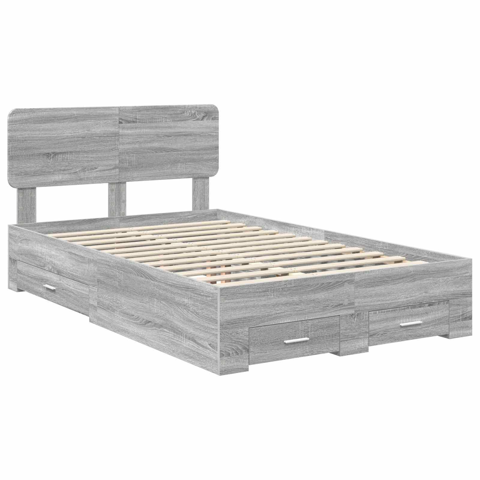 Ein graues Holzbettgestell mit einem Kopfteil und drei Aufbewahrungsschubladen darunter. Es fehlt ein Matratze und es verfügt über eine Lattenrost.