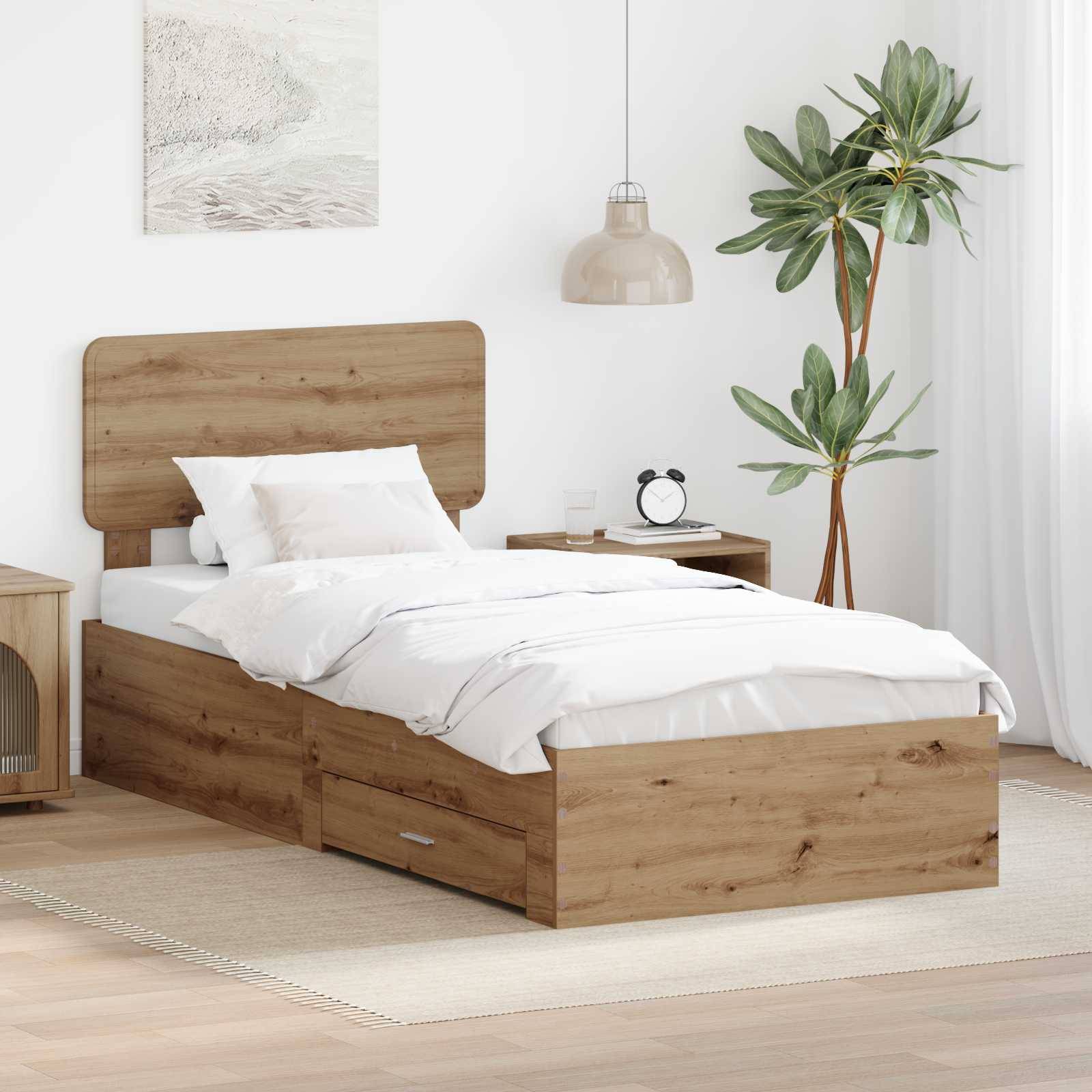Ein modernes Schlafzimmer verfügt über ein einzelnes Holzbett mit weißer Bettwäsche, einen Nachttisch mit einer Lampe und eine große Pflanze in der Ecke.
