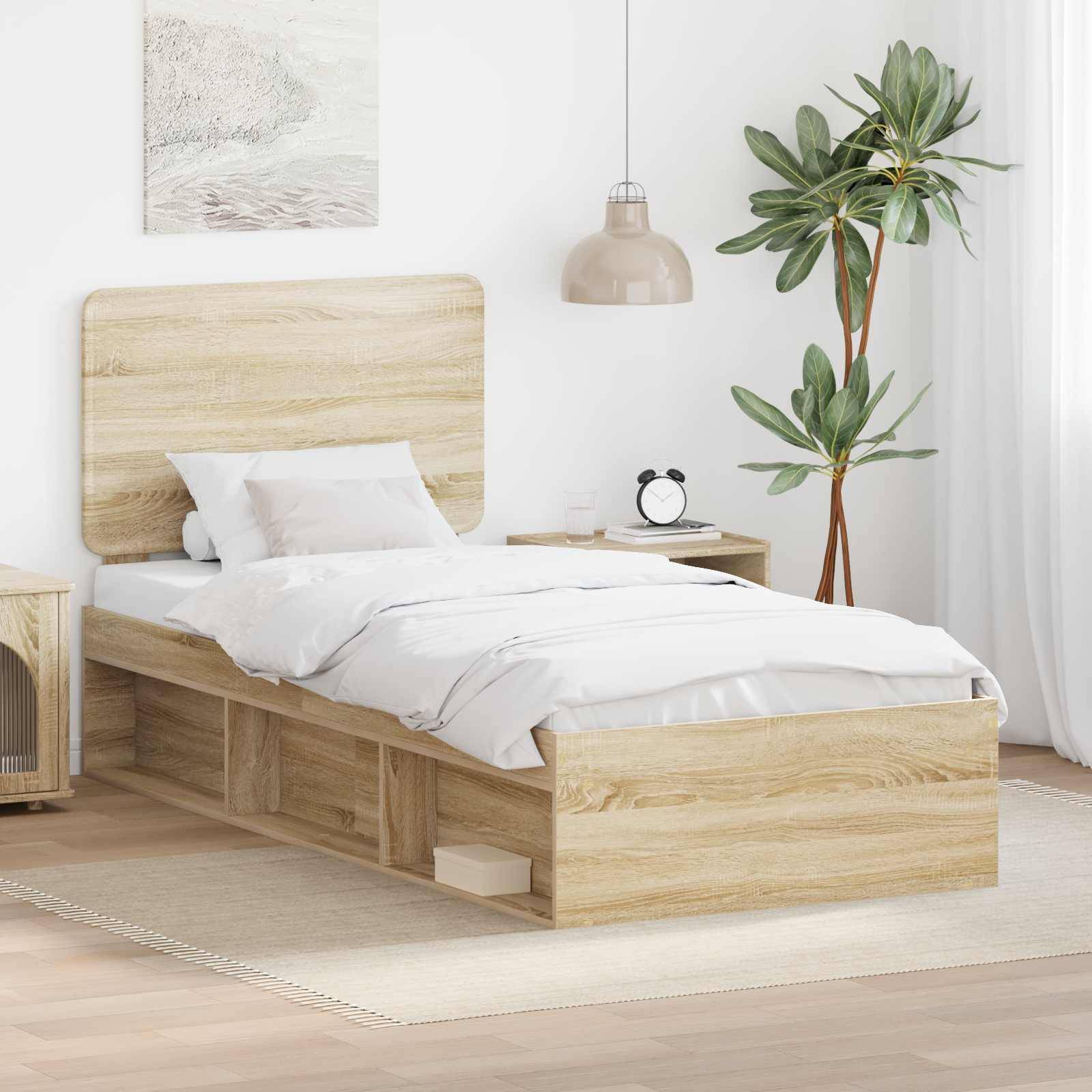 Ein modernes Schlafzimmer präsentiert ein Holzbett mit weißer Bettwäsche, einen Nachttisch, eine hängende Lampe und eine Topfpflanze, die eine ruhige Atmosphäre schaffen.
