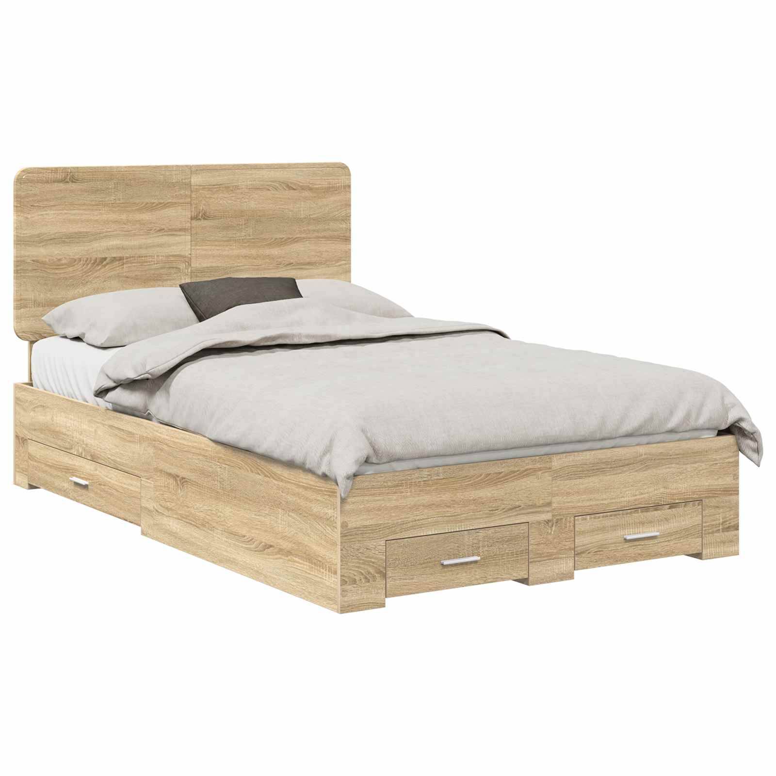 Ein Holzbett mit einer hellbraunen Oberfläche, ausgestattet mit einem Kopfteil und drei Staurageschubladen darunter, ist mit weißer Bettwäsche und einer grauen Decke bezogen.