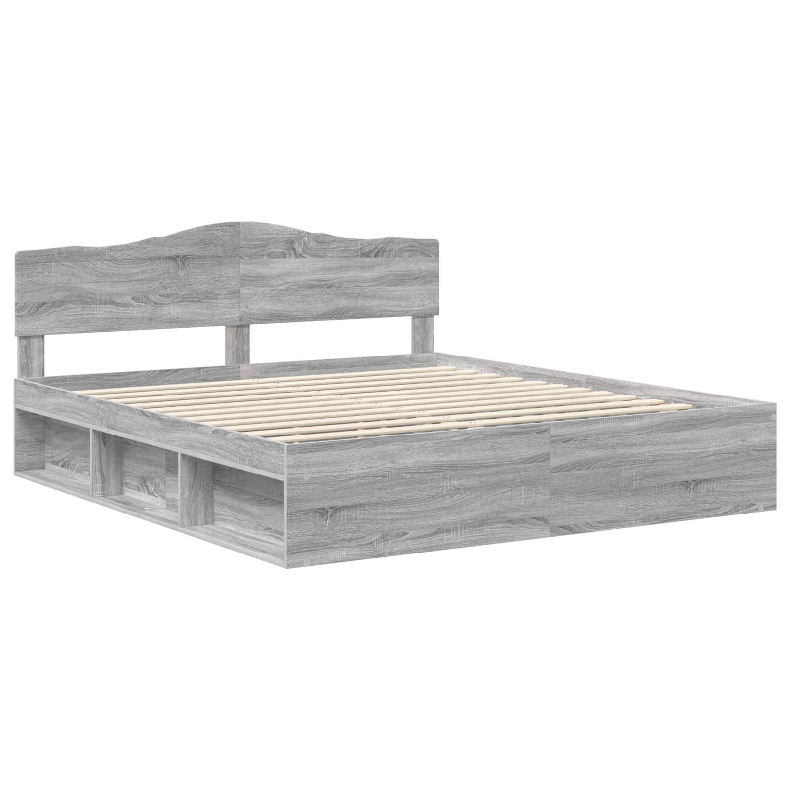 Ein Holzbettgestell mit grauer Beschichtung, ausgestattet mit einem Kopfteil und integrierten Stauraumbereichen unter dem Bett.