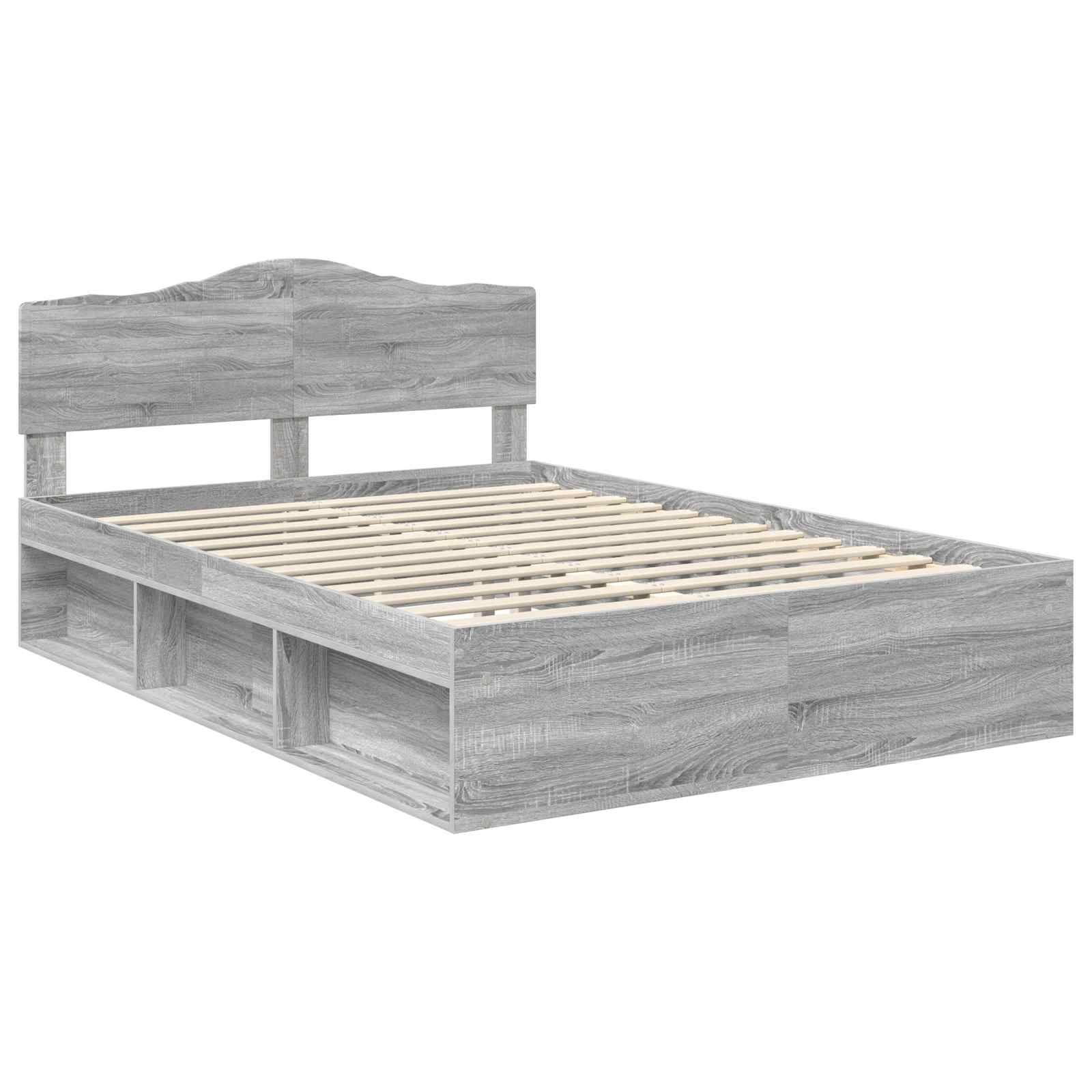 Ein grauer Holzbettrahmen mit einem Kopfteil und Ablageregalen am Fußende, konzipiert für eine Einzelmatratze.