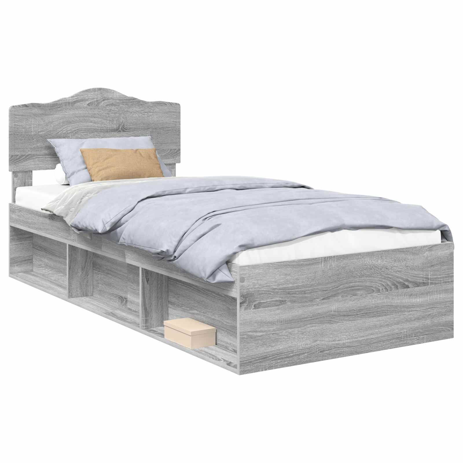 Ein grauer Holz-Doppelbett mit Kopfteil, blauer Bettwäsche, zwei Kissen und eingebauten Regalen an der Basis, in denen eine beige Box steht.