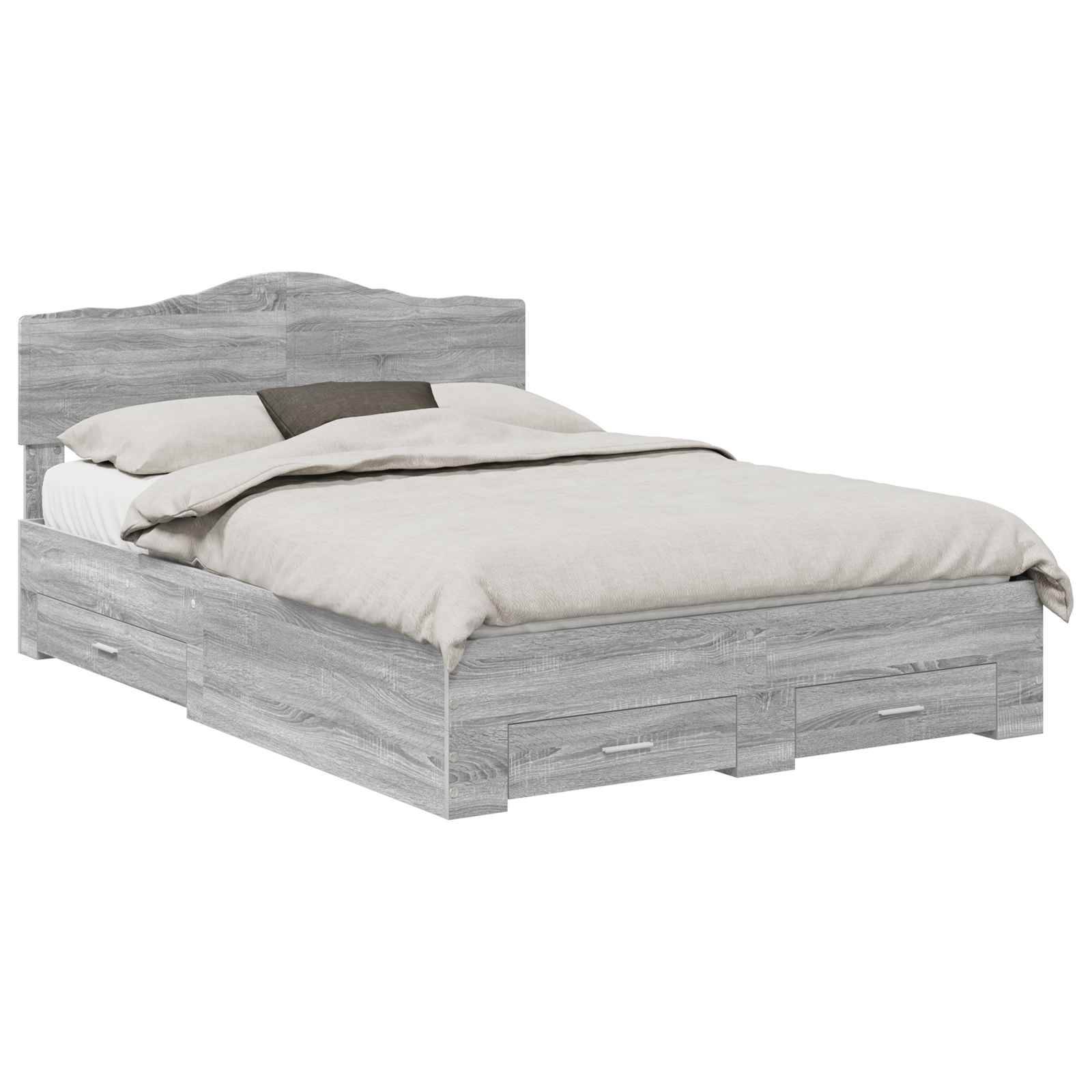 Ein Holzbettgestell mit weicher Grauton-Oberfläche, ausgestattet mit Staurageschubladen darunter. Das Bett ist mit hellgefärbter Bettwäsche und Kissen bezogen.