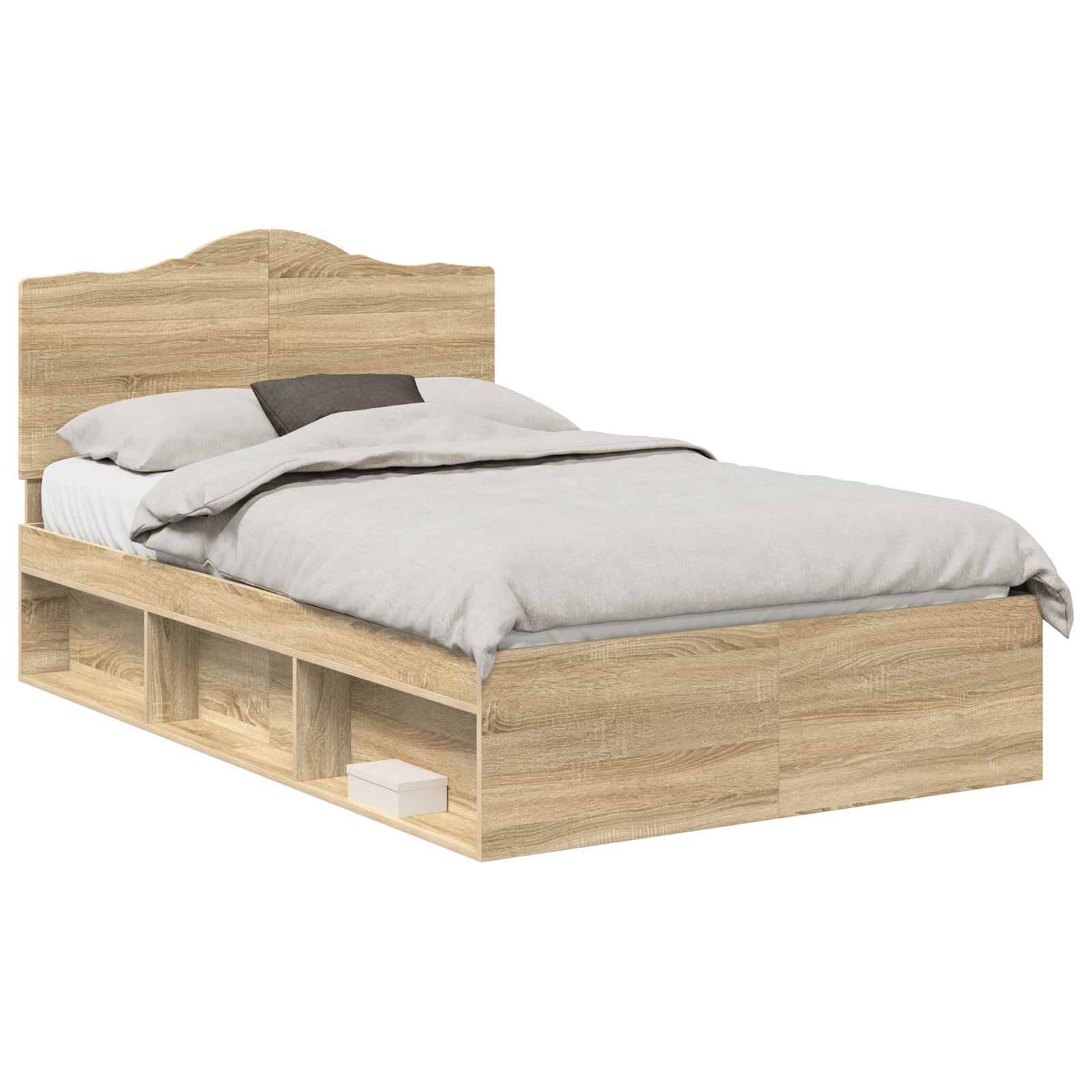 Ein Holz-Einzelbett mit Kopfteil, graue Bettwäsche und integrierten unteren Ablagen, wobei eine ein Buch und die andere einen Gegenstand enthält.