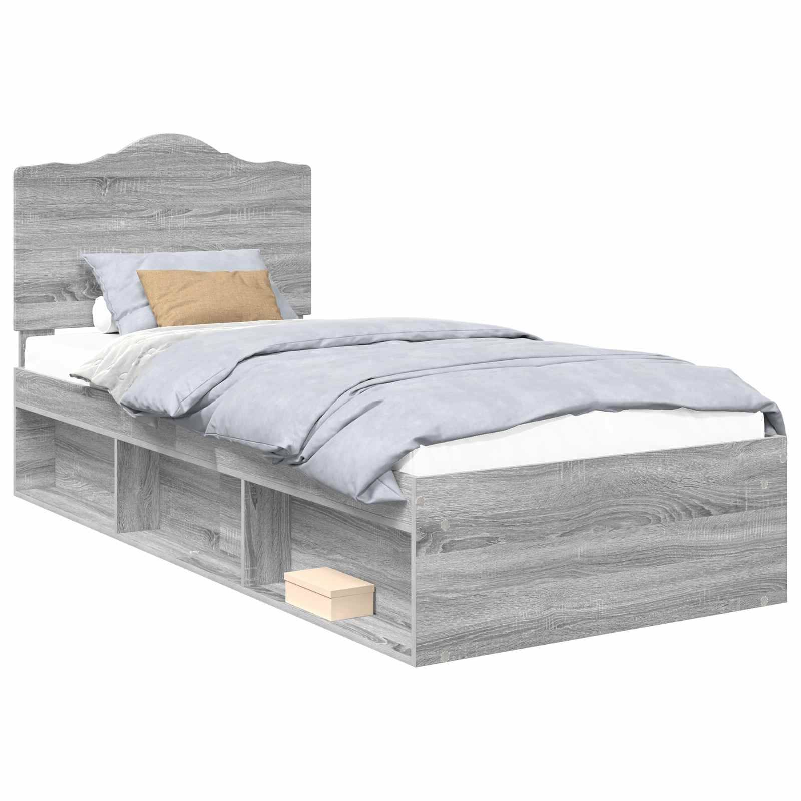 Ein grauer Holzbett mit Kopfteil, ausgestattet mit blauer Bettwäsche, einem braunen Akzentküssen und Stauraum-Schubladen unter dem Bett, in denen sich eine hellgefärbte Box befindet.
