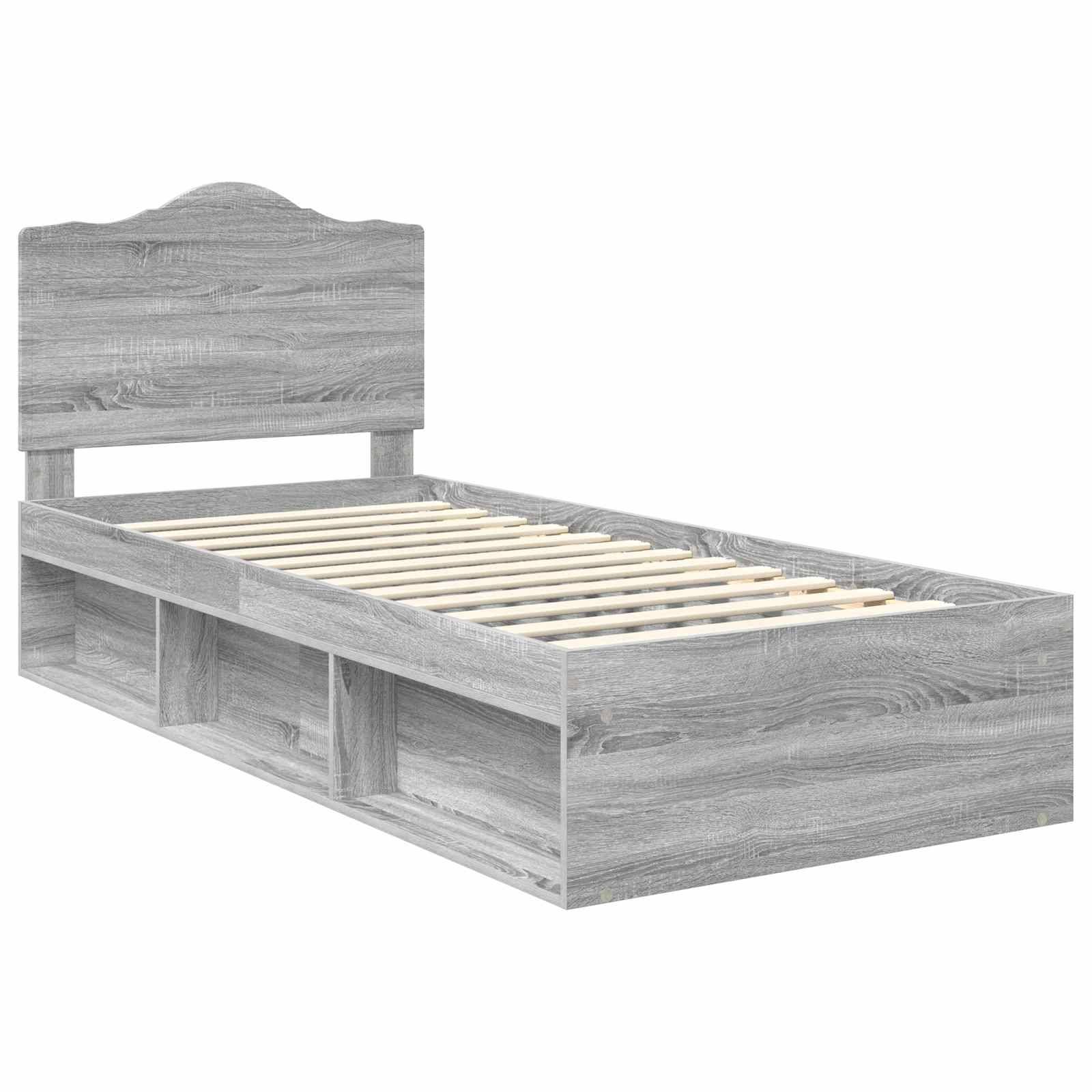 Ein grauer Holz-Einzelbettrahmen mit hohem Kopfteil und integrierten Stauraumregalen darunter. Es wird ohne Matratze gezeigt.