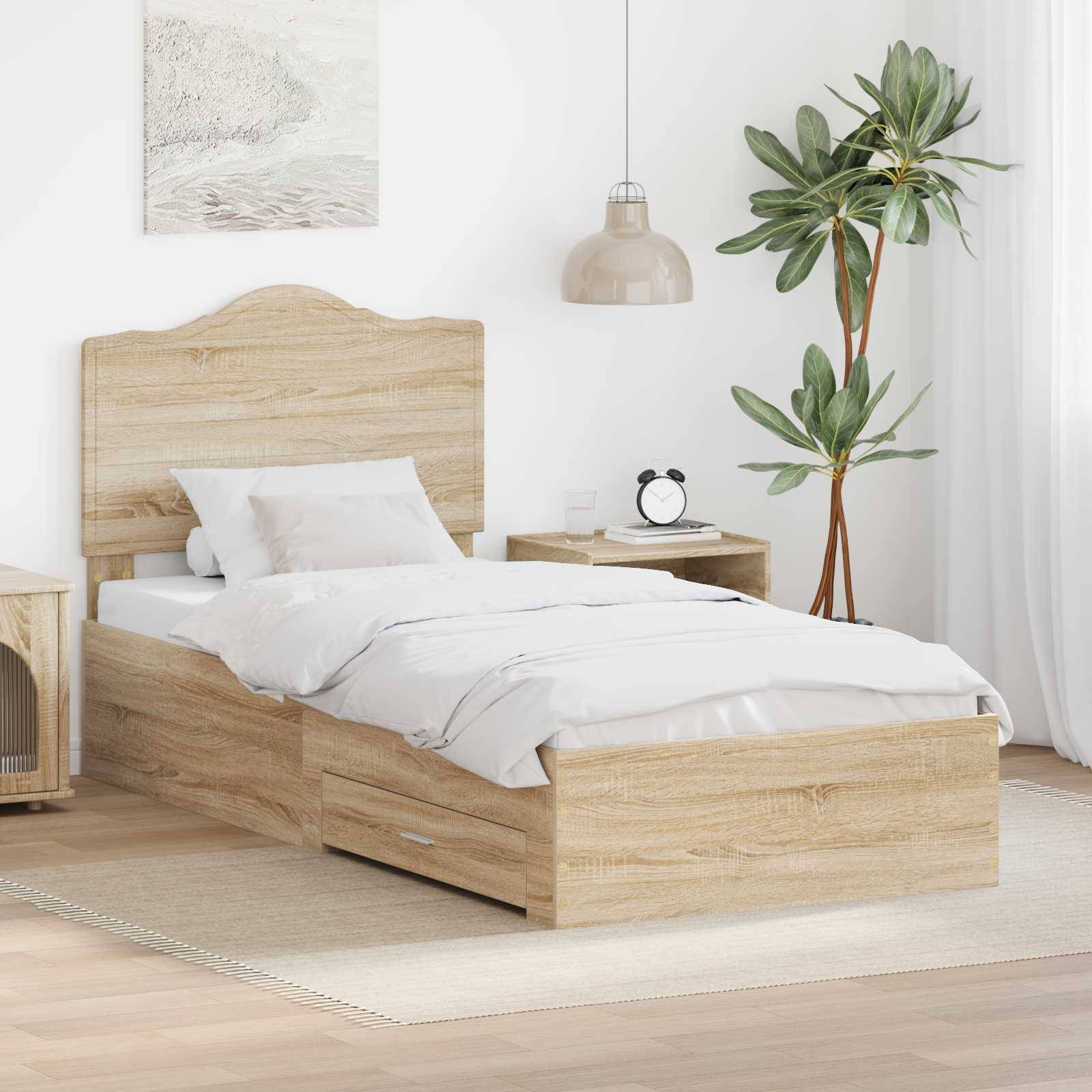 Modernes Schlafzimmer mit einem hellen Holzbett mit weißer Bettwäsche, einem passenden Nachttisch, einer Topfpflanze und einem gerahmten Wandkunstwerk.