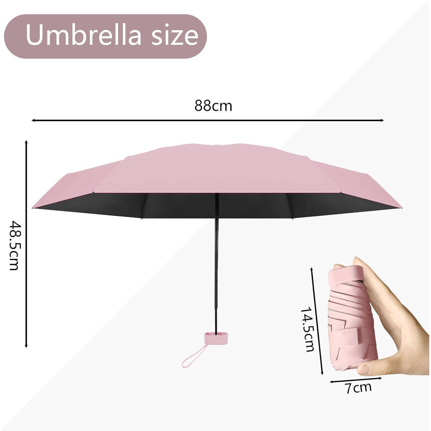 Rosa Regenschirm mit Abmessungen: geöffneter Durchmesser 88 cm, Höhe 48,5 cm; geschlossene Höhe 14,5 cm, Breite 7 cm. Hand hält geschlossenen Regenschirm.