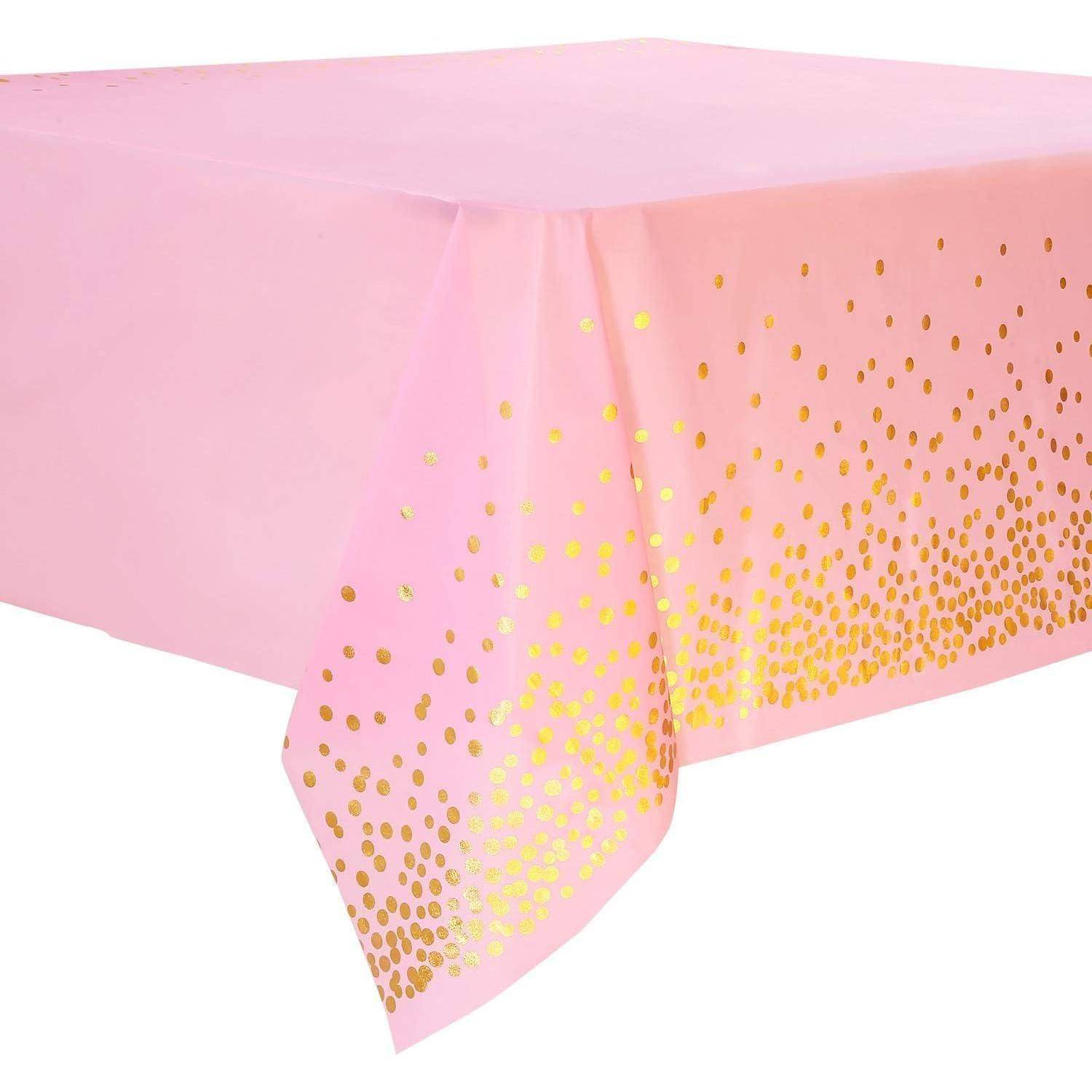 Rosa Tischdecke mit goldfarbenem Polka-Dot-Verlaufsdesign entlang der Kanten.