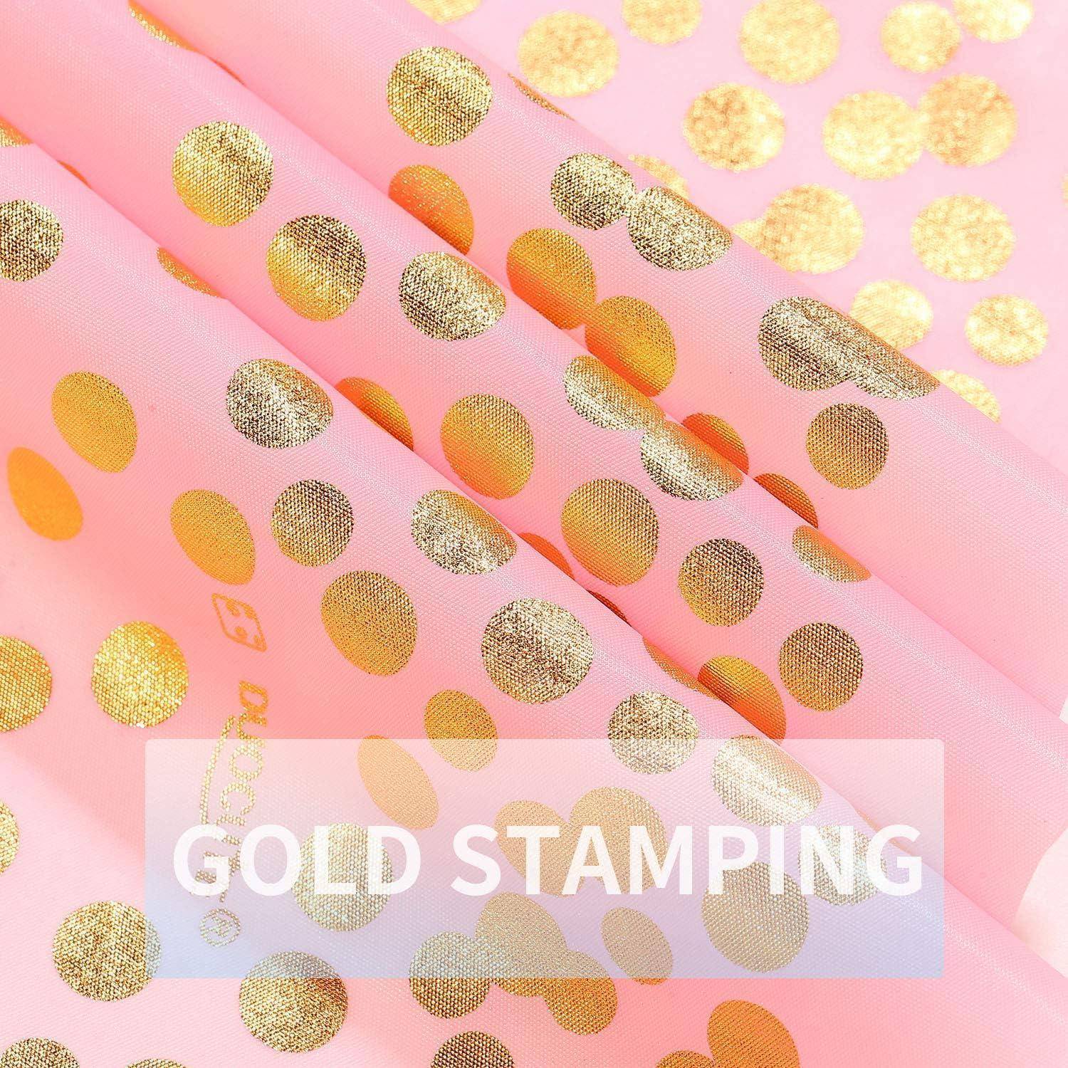 Eine Nahaufnahme von rosa Stoff mit goldenen Polka Dots und dem Text ‚Gold Stamping', der eine dekorative Designtechnik andeutet.