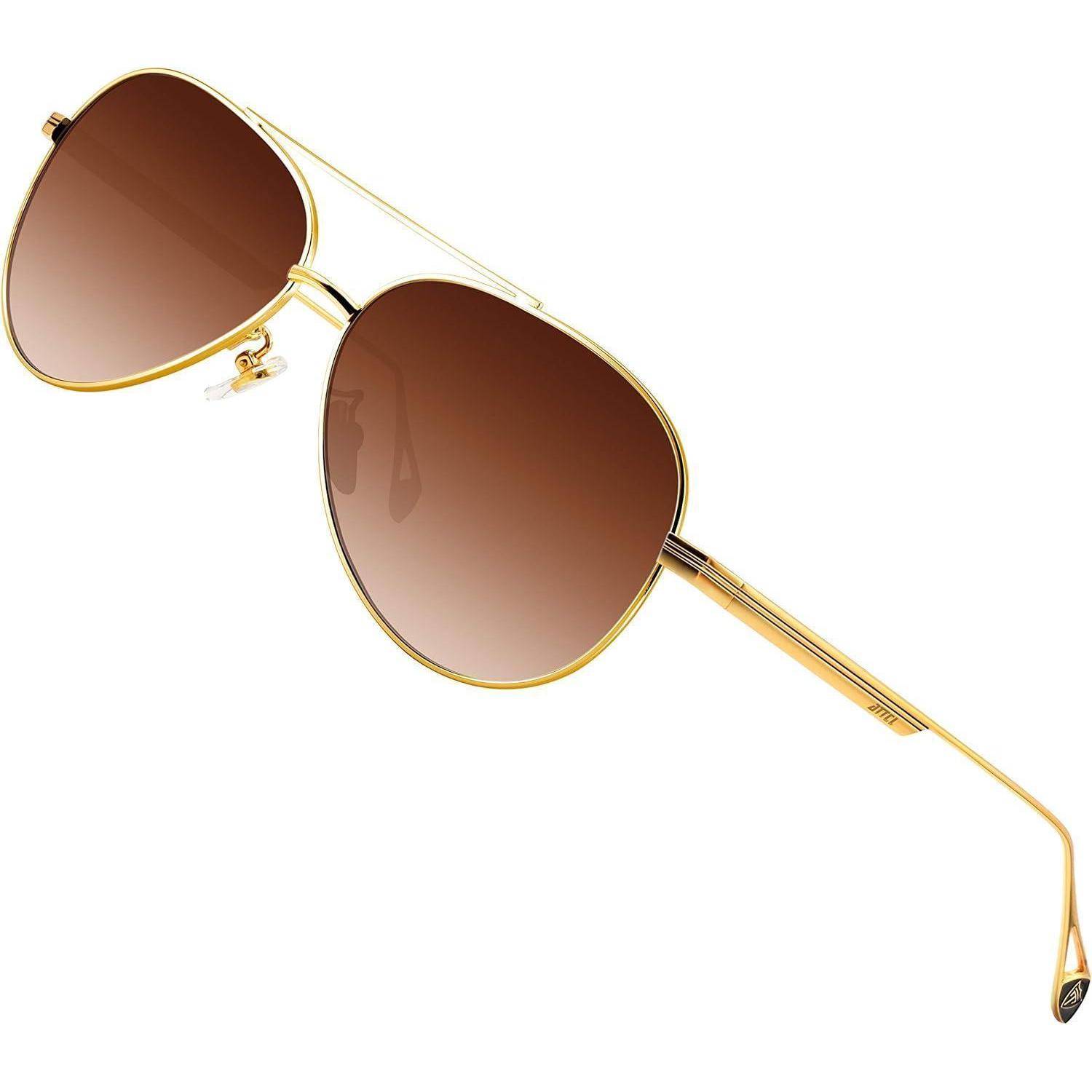 Ein Paar Pilotensonnenbrille mit goldenen Rahmen und braunen Verlaufsgläsern vor einem weißen Hintergrund.