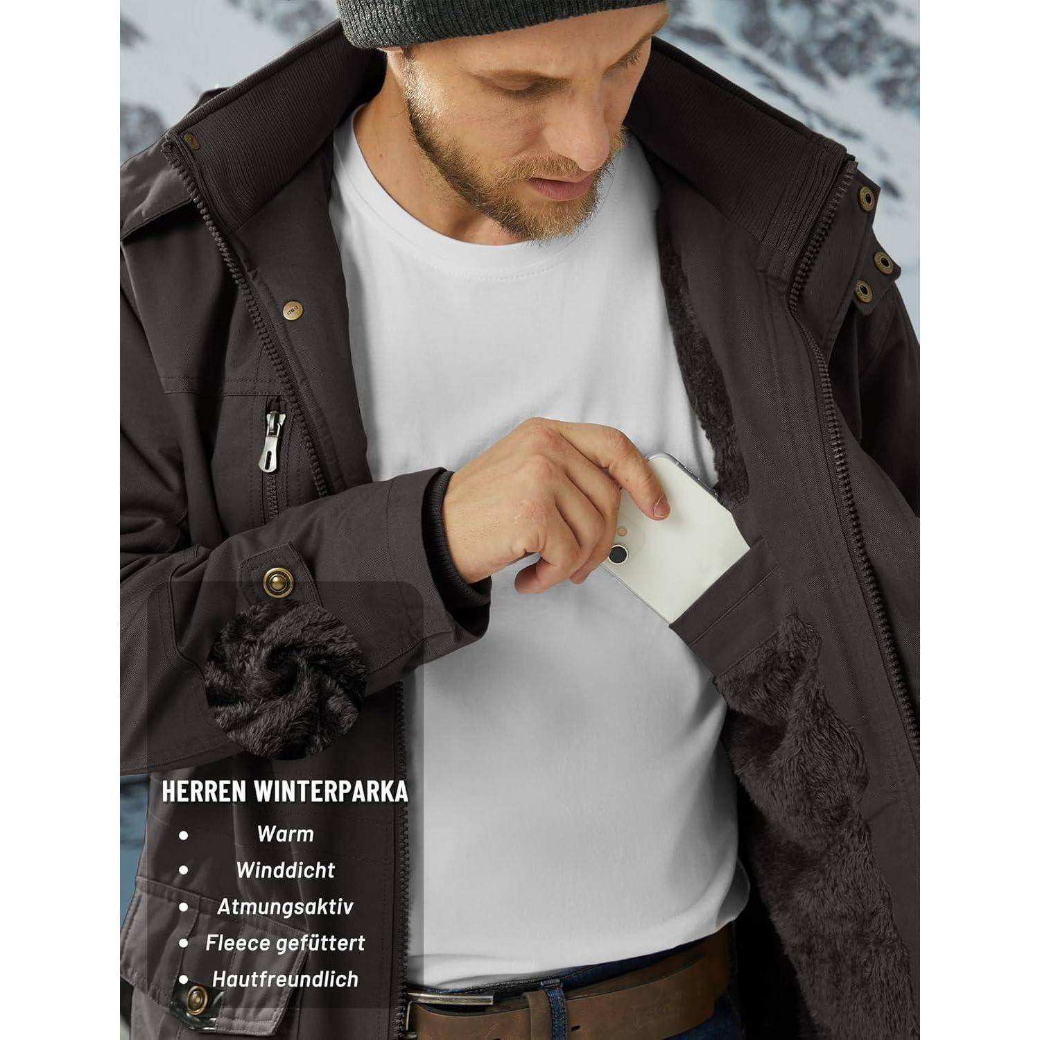 Ein Mann trägt einen schwarzen Winterparka und zeigt ein weißes Telefon, das innen verstaut ist. Der deutsche Text hebt Eigenschaften wie Wärme und Windresistenz hervor.