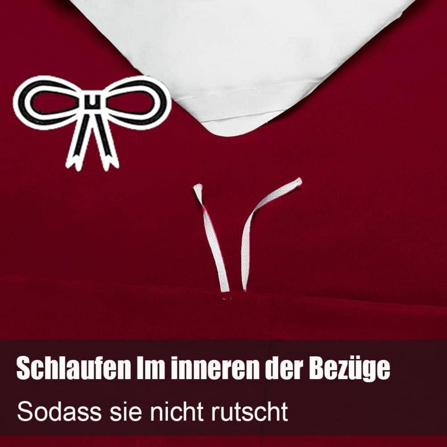 Das Bild zeigt ein herzförmiges Kissen unter einem weißen Laken auf rotem Hintergrund. Weiße Bänder sind sichtbar mit Text auf Deutsch darunter.