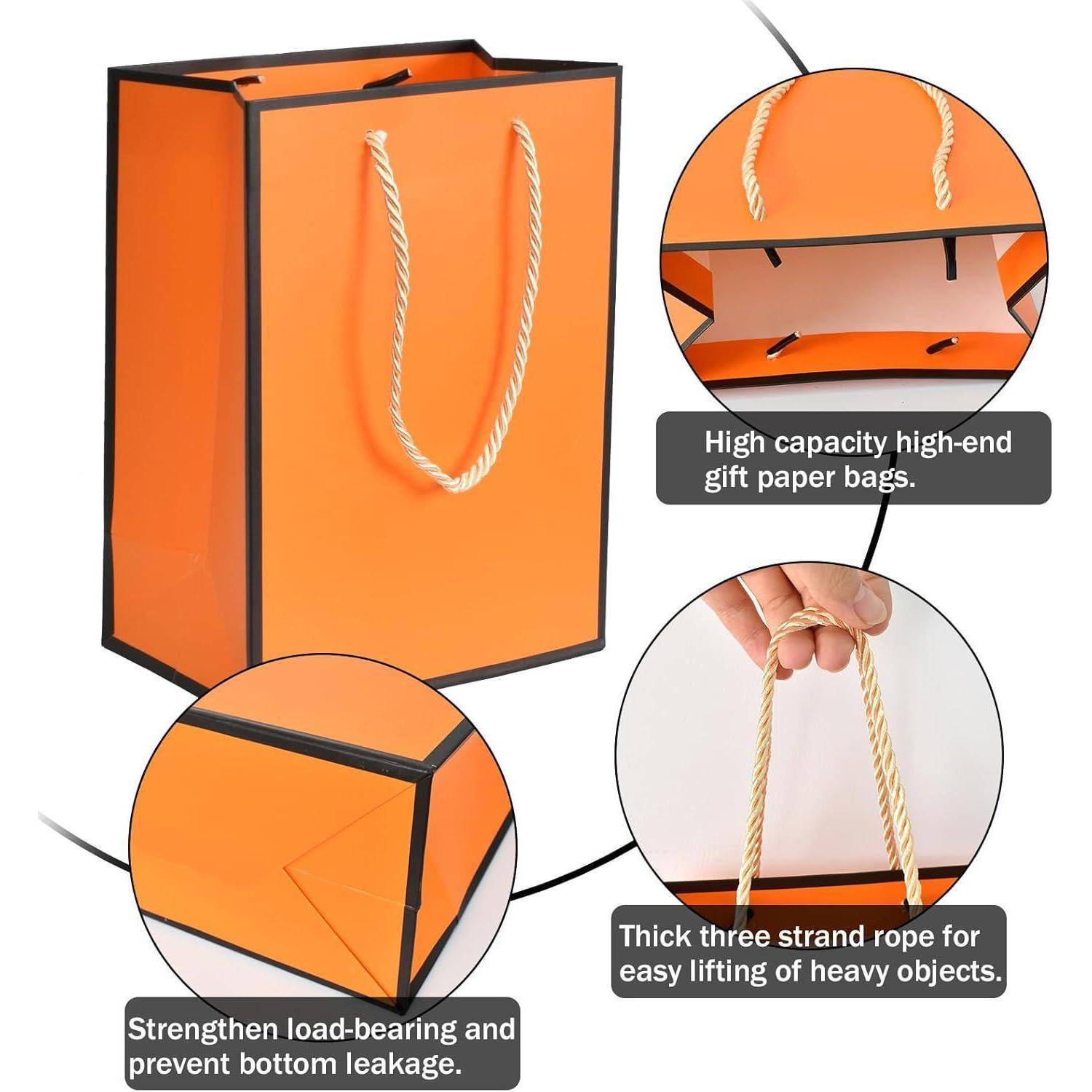 Orangefarbene Geschenktasche mit einem dicken Seilgriff, entwickelt für schwere Gegenstände. Zu den Merkmalen gehören hohe Kapazität, verstärkter Boden und robuste Konstruktion.
