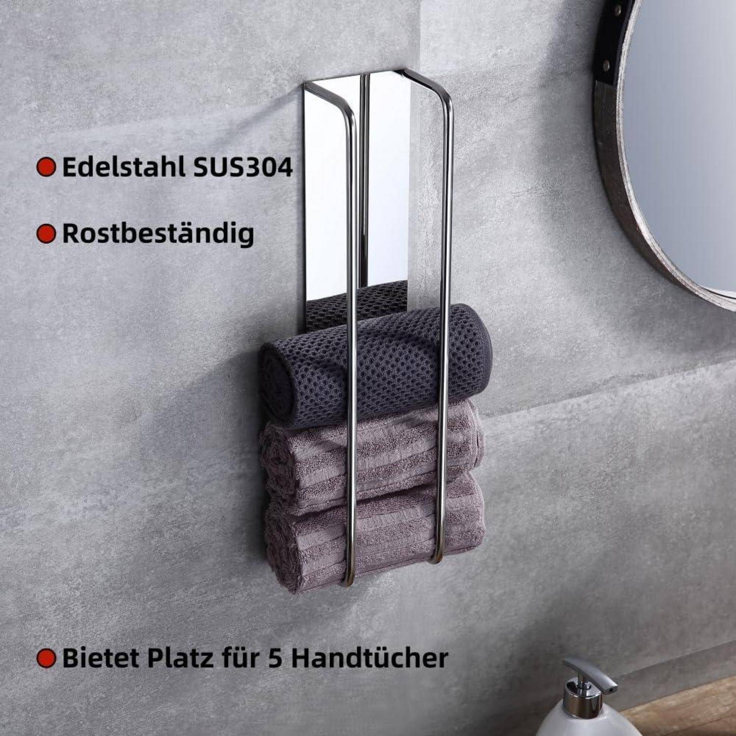 An der Wand montiertes Handtuchhalter aus Edelstahl mit drei grauen Handtüchern. 'Edelstahl SUS304', 'Rostbeständig' und 'Bietet Platz für 5 Handtücher' Text. Runder Spiegel sichtbar.