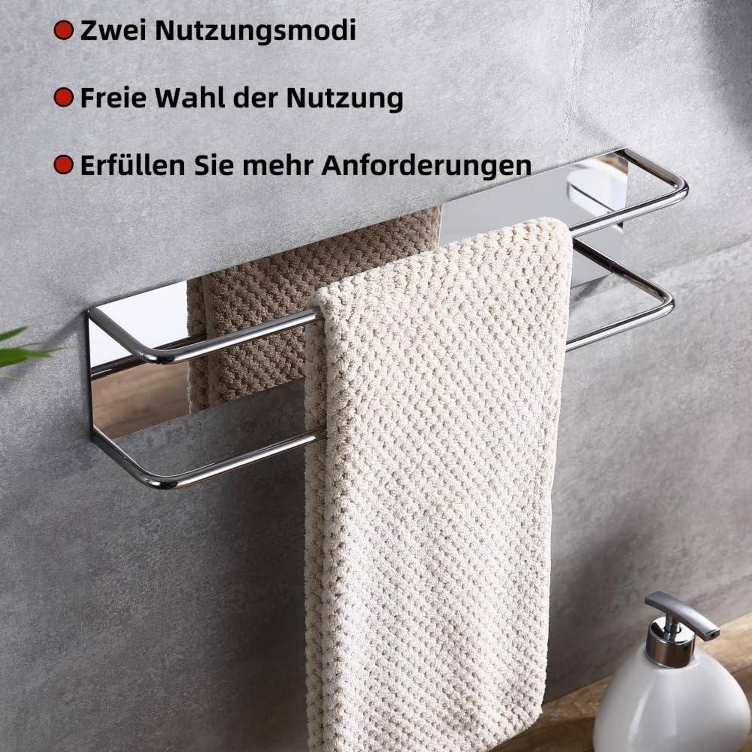 Ein Handtuch hängt an einem glänzenden, verchromten Doppel-Handtuchhalter vor einer grauen Wand; deutscher Text hebt die Merkmale des Produkts hervor.