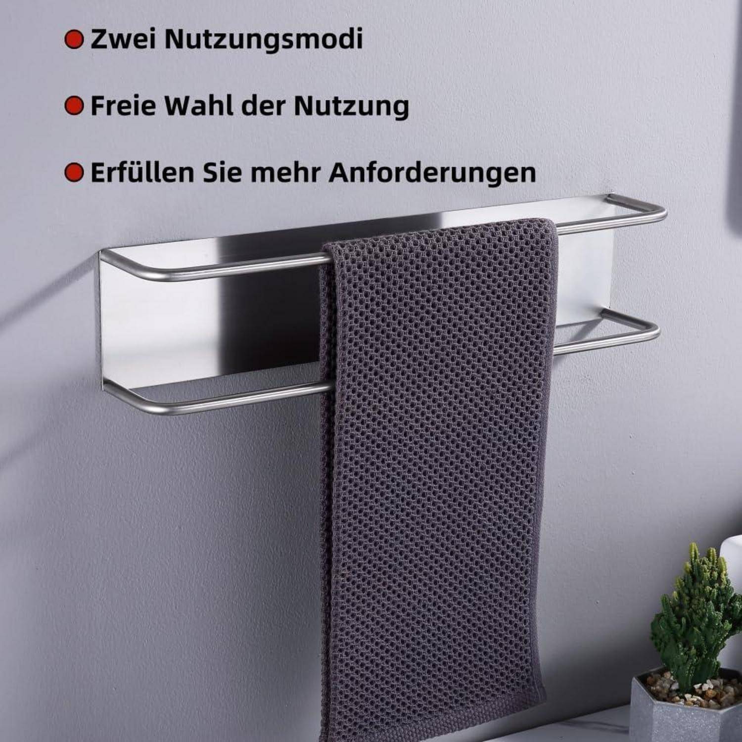 Ein silberner Handtuchhalter mit einem grauen Handtuch, das daran hängt. Text auf Deutsch listet 'Zwei Nutzungsmodi', 'Freie Wahl der Nutzung', 'Erfüllen Sie mehr Anforderungen'.