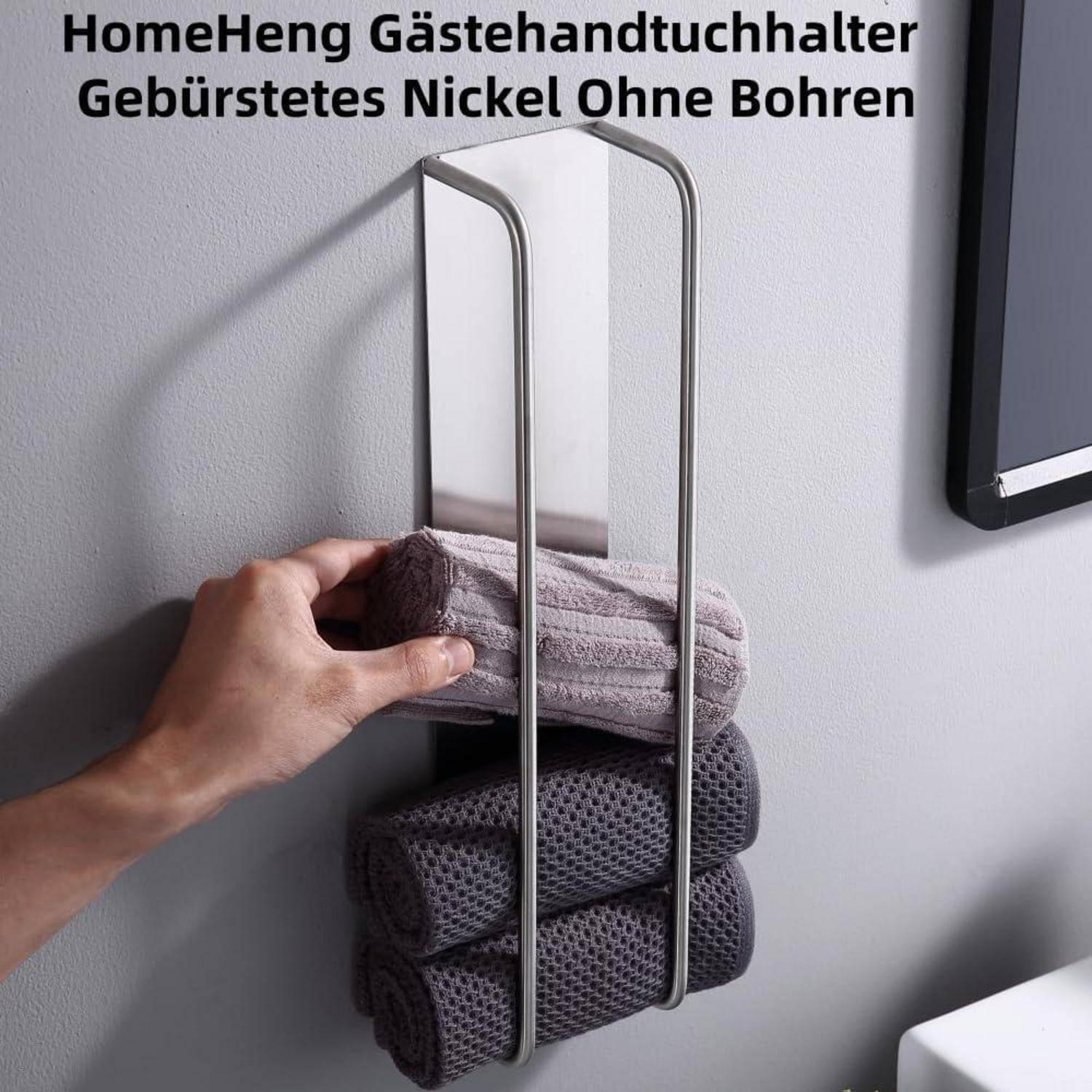 Eine Hand platziert ein aufgerolltes Handtuch in einen wandmontieren Handtuchhalter mit drei Schlitzen. Text lautet 'HomeHeng Gästehandtuchhalter Gebürstetes Nickel Ohne Bohren'.