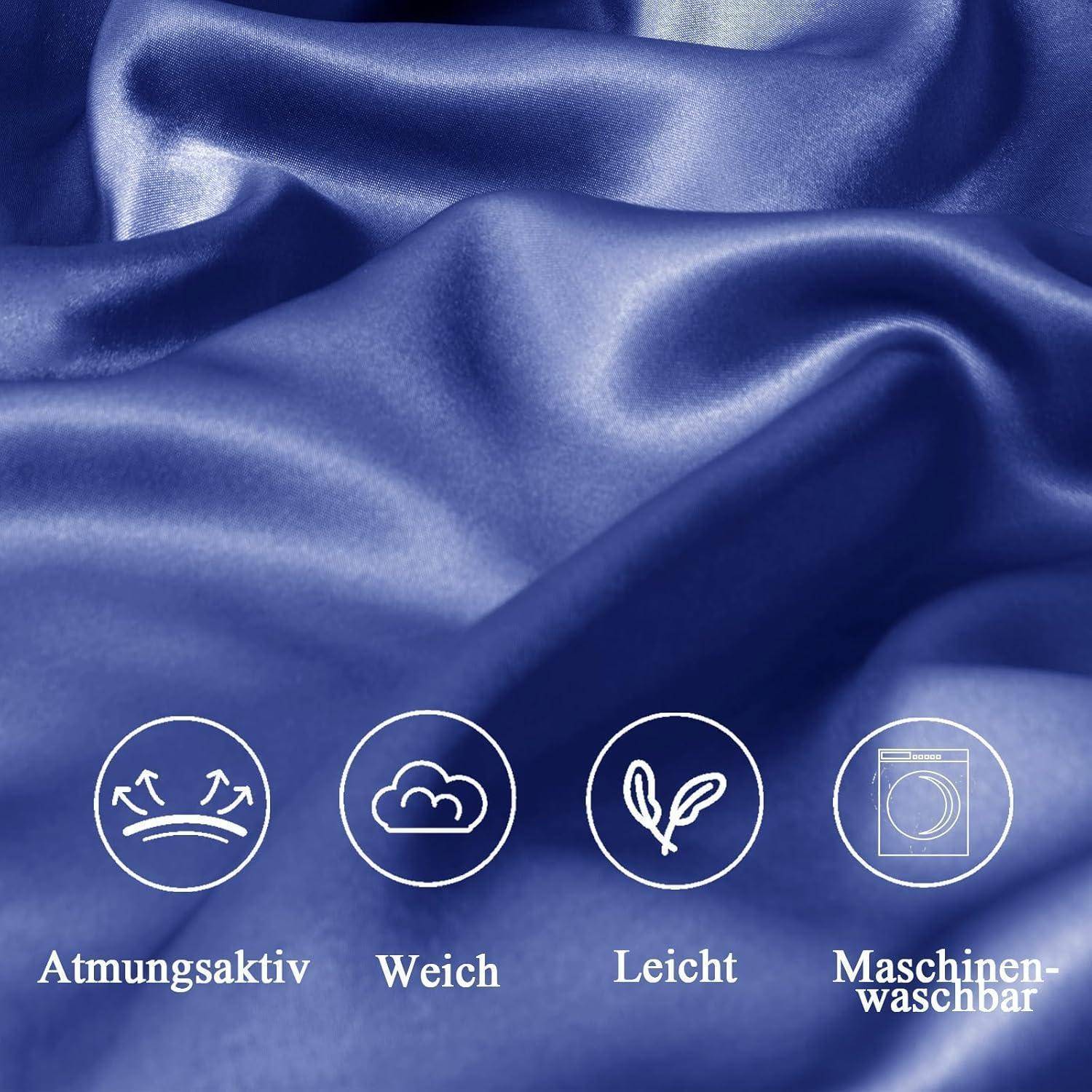 Glatte, fließende blaue Stoff mit Symbolen und deutschen Texten, die angeben, dass er atmungsaktiv, weich, leicht und maschinenwaschbar ist.