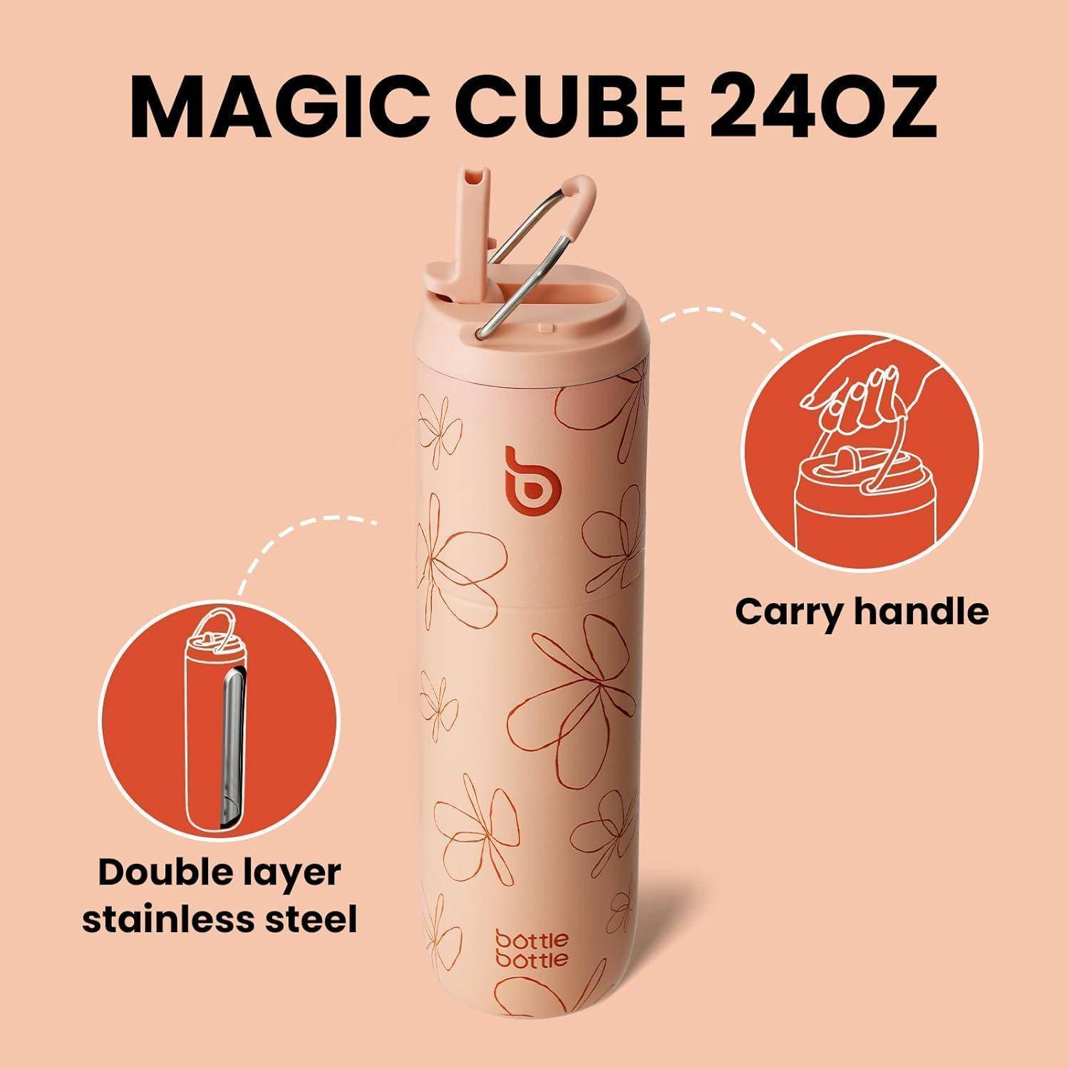 Eine rosa isolierte Wasserflasche mit Blumendesigns, beschriftet mit 'MAGIC CUBE 24OZ'. Zu den Merkmalen gehören doppelwandiger Edelstahl und ein Tragegriff.