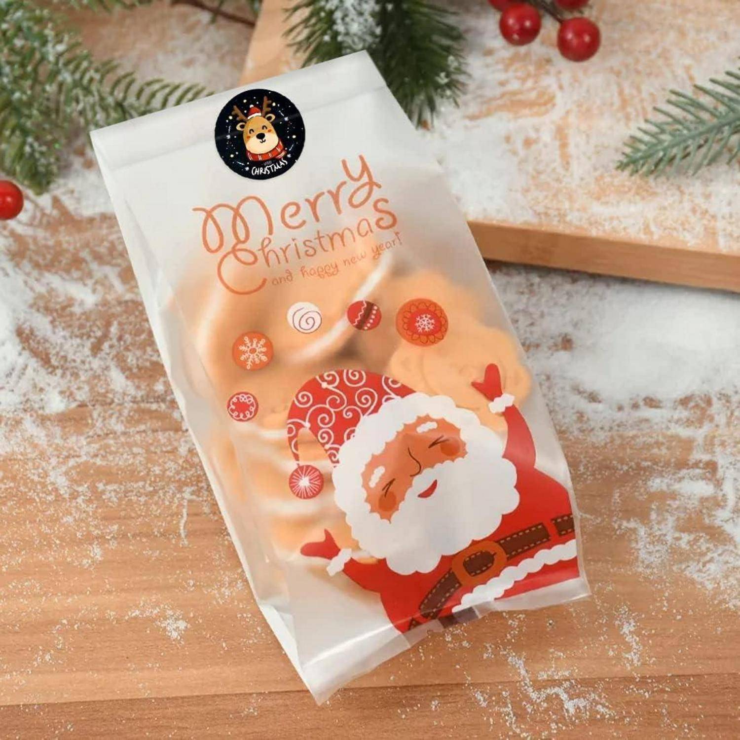 Weihnachtlich gestaltete Leckertüte mit einer fröhlichen Weihnachtsmann-Illustration und dem Text „Frohe Weihnachten