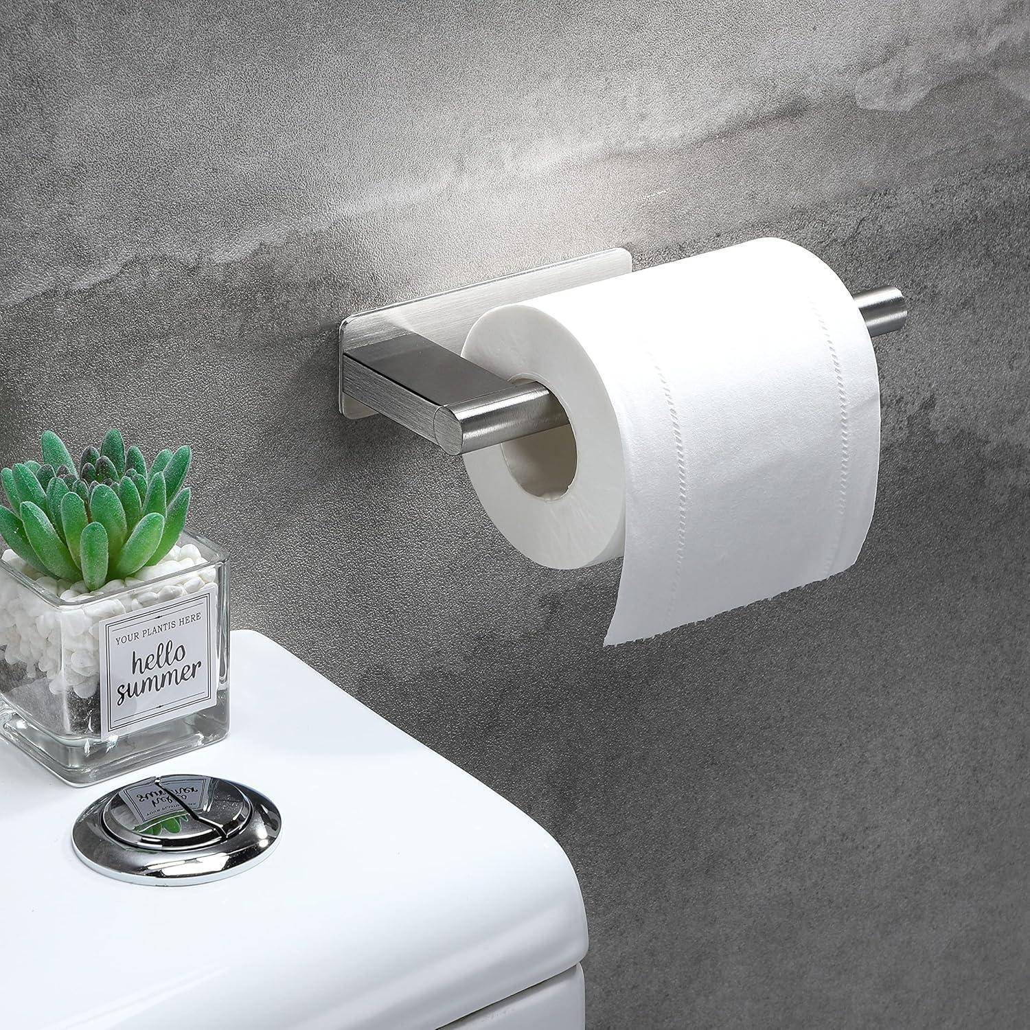 Toilettenpapierrolle auf einer Wandhalterung mit rechteckigem Blumentopf, beschriftet mit 