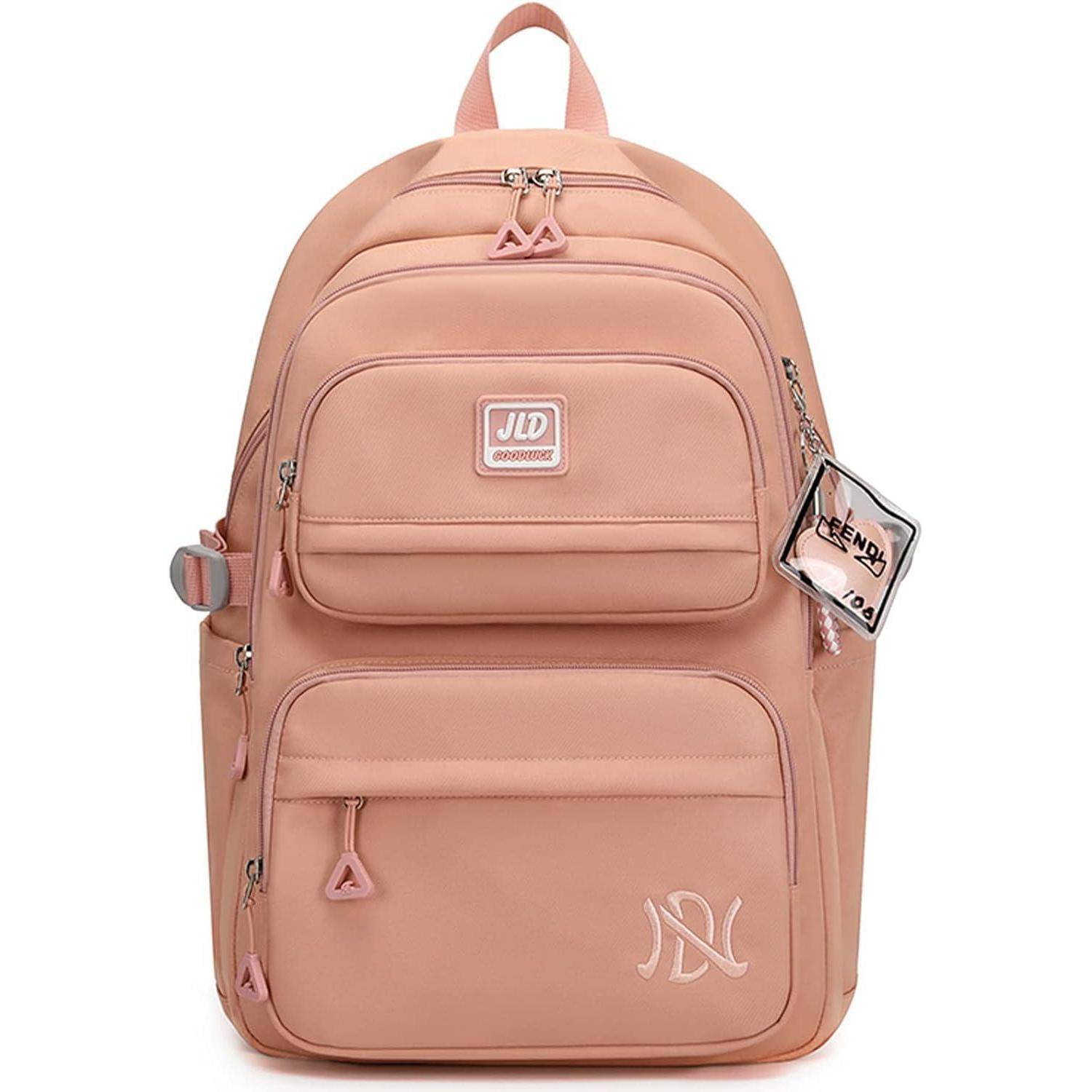 Ein pfirsichfarbener Rucksack mit mehreren Fächern und einem 'JLD' Logo. Er verfügt über pinke Reißverschlüsse und ein kleines angehängtes Etikett.