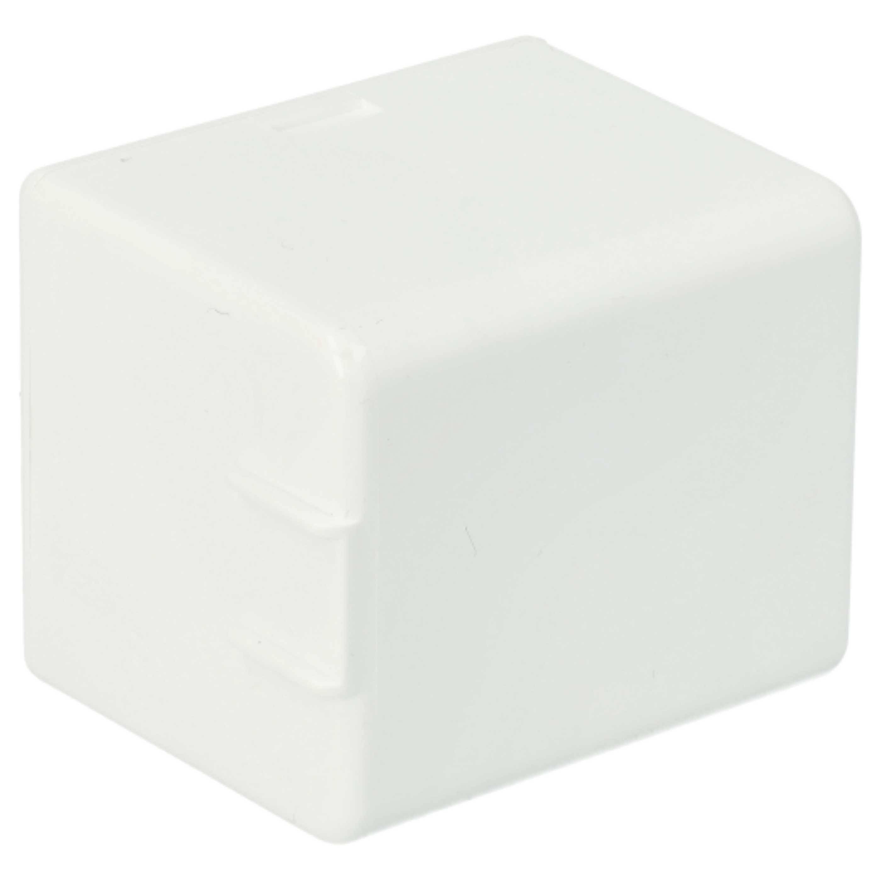 Ein weißer rechteckiger Plastikblock mit zwei kleinen Vorsprüngen an einer Seite.